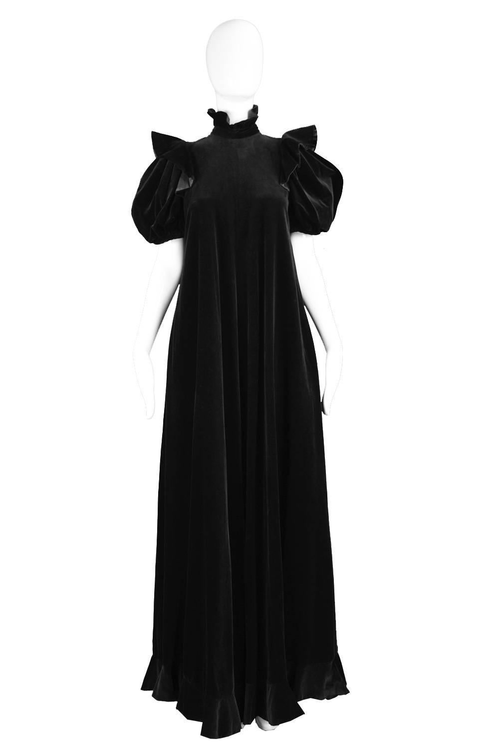 An incredible vintage black velvet gown from the 1970s by iconic British designer, Gina Fratini - a contemporary of and arguably an equal to Ossie Clark and Thea Porter. 

Estimated Size: UK 8-10/ US 4-6/ EU 36-38 
Bust - 34” / 86cm
Waist -