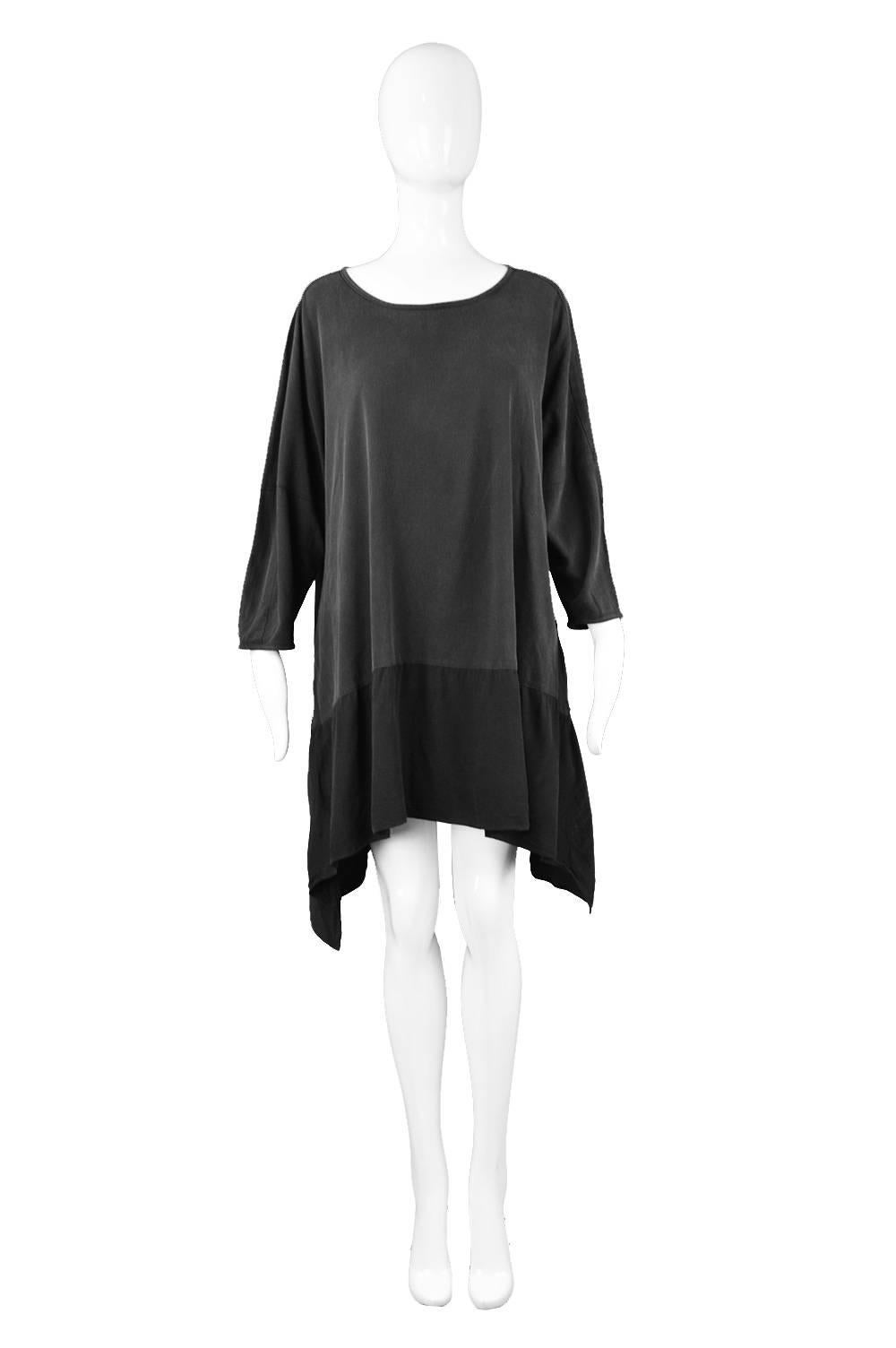 An incredible vintage women's vintage tunic mini dress by rare, highly sought after label, Workers for Freedom. In a minimalist/ lagenlook style from the Spring Summer 1995 collection. In a black cotton with a faded effect on top and a slinky rayon