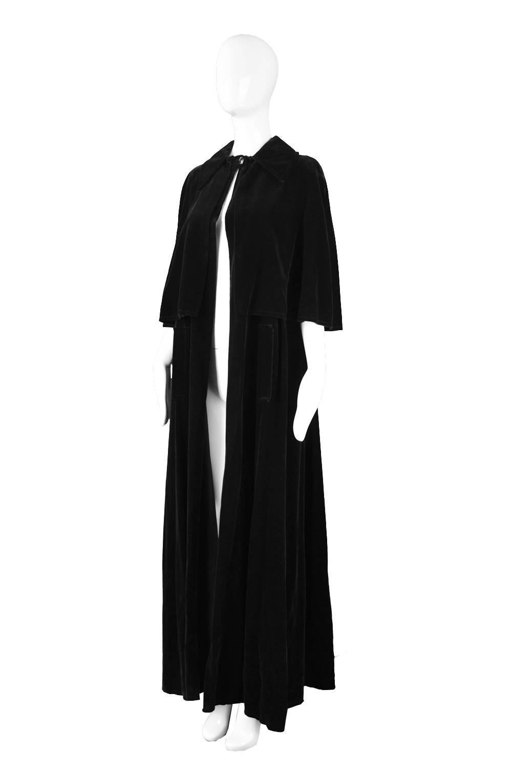 A rare, dramatic and sophisticated vintage full length cape/ cloak by couturier and highly collectible French designer, Louis Feraud c.late 1960s or early 1970s. 

Size: Women's Small to Large - not meant to be fitted.
Bust - Up to 44” /