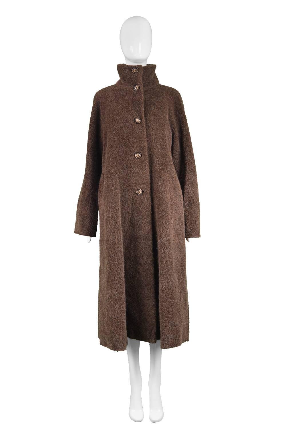 A beautiful vintage women's swing coat by luxury designer, Max Mara. In a luxurious, fuzzy brown alpaca wool and virgin wool with a high funnel neck that adds a chic, high fashion look whilst staying classic. Perfect for fall and