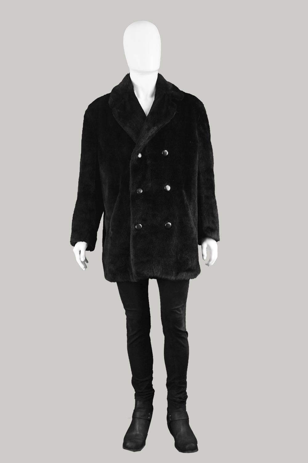 An incredible and rare vintage mens faux fur coat from the 70s by legendary British designer, Hardy Amies for his ready to wear line for menswear label, Hepsworths. In a classic black faux fur, with double breasted buttons down the front to give an