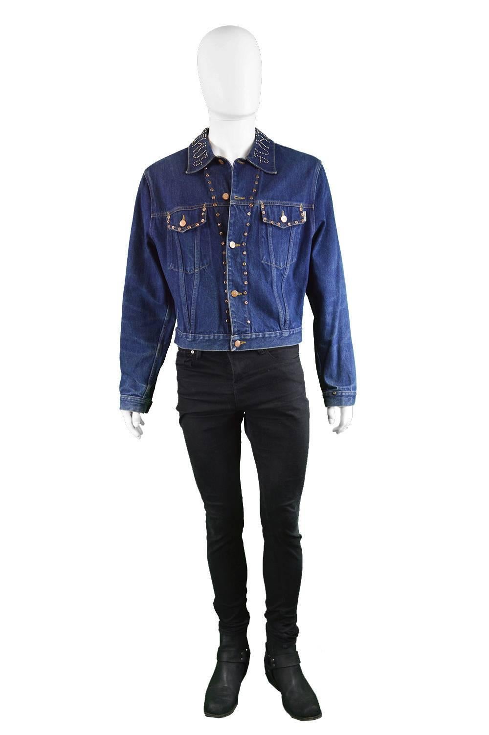 An incredible vintage mens denim jacket from the late 1980s/ early 1990s by genius french designer, Jean Paul Gaultier for his highly collectible Junior Gaultier line. With western style stud details throughout, spelling out 'Junior Gaultier on the