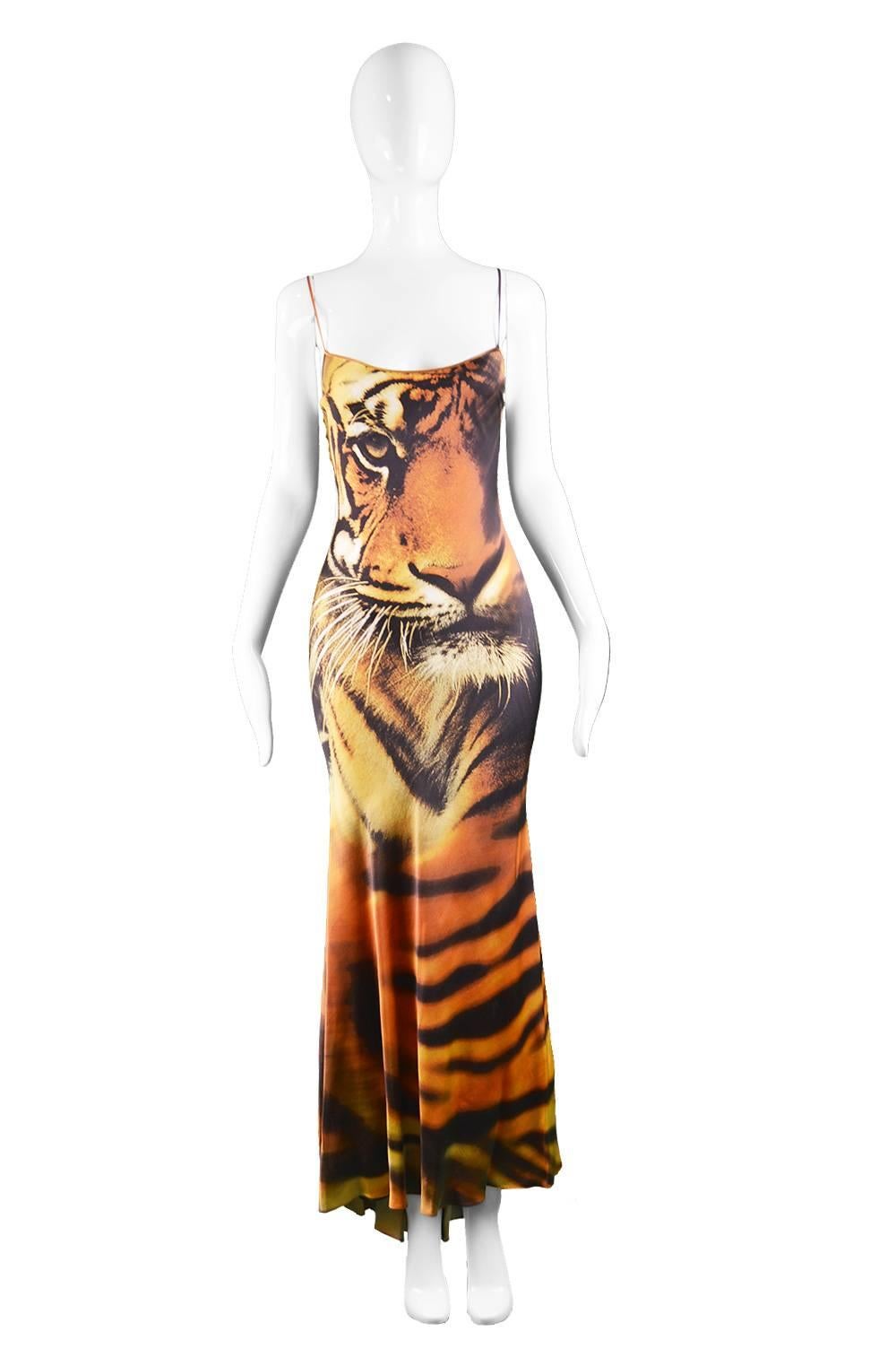 An incredibly glamorous evening gown c. A/W 2000 by Italian designer, Roberto Cavalli. In an extremely flattering bias cut silk charmeuse with delicate spaghetti straps and a flared, subtle train at the back - perfect for the red carpet. The bold