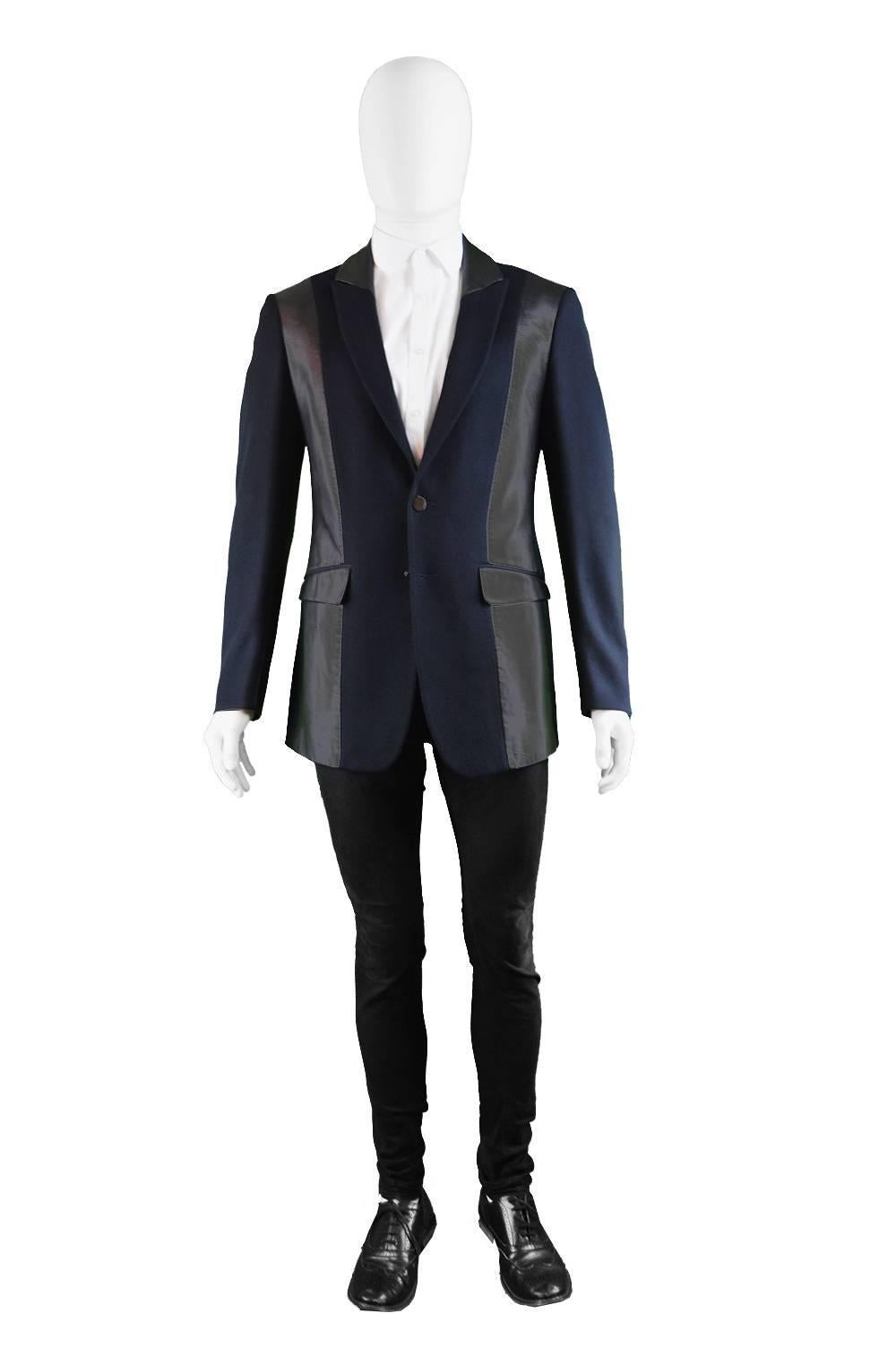 An excellent vintage mens Thierry Mugler jacket from circa the 1990s in a navy blue pure wool with black leather (possibly high quality faux leather) panels on the body, sleeves & collar which looks so current. The lapels have Muglers signature