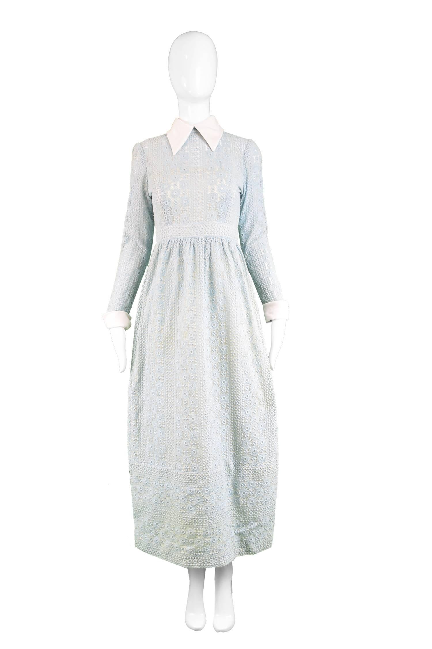 A stunning vintage maxi dress from the early 70s by Victor Costa for his 'Romantica' line. In a pale mint broderie anglaise over an organza fabric that looks almost like a crochet or lace from afar but with much more structure. It features a cream