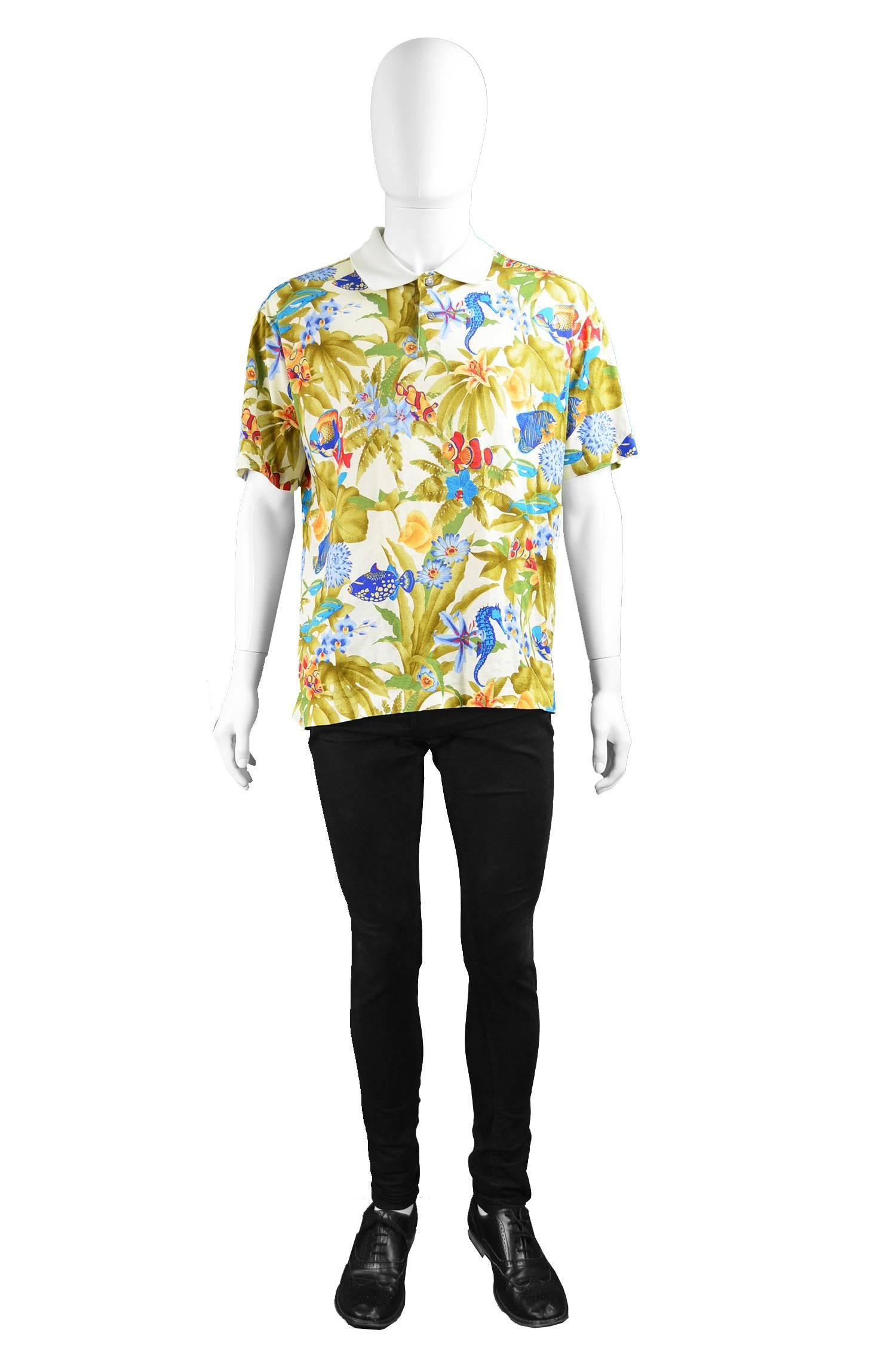 A vibrant and fun vintage men's short sleeve t shirt from the 90s by luxury French fashion house, Leonard of Paris for their rare men's 'Homme' line. In a super soft cotton jersey, printed with a bold, multicolored underwater theme, including floral