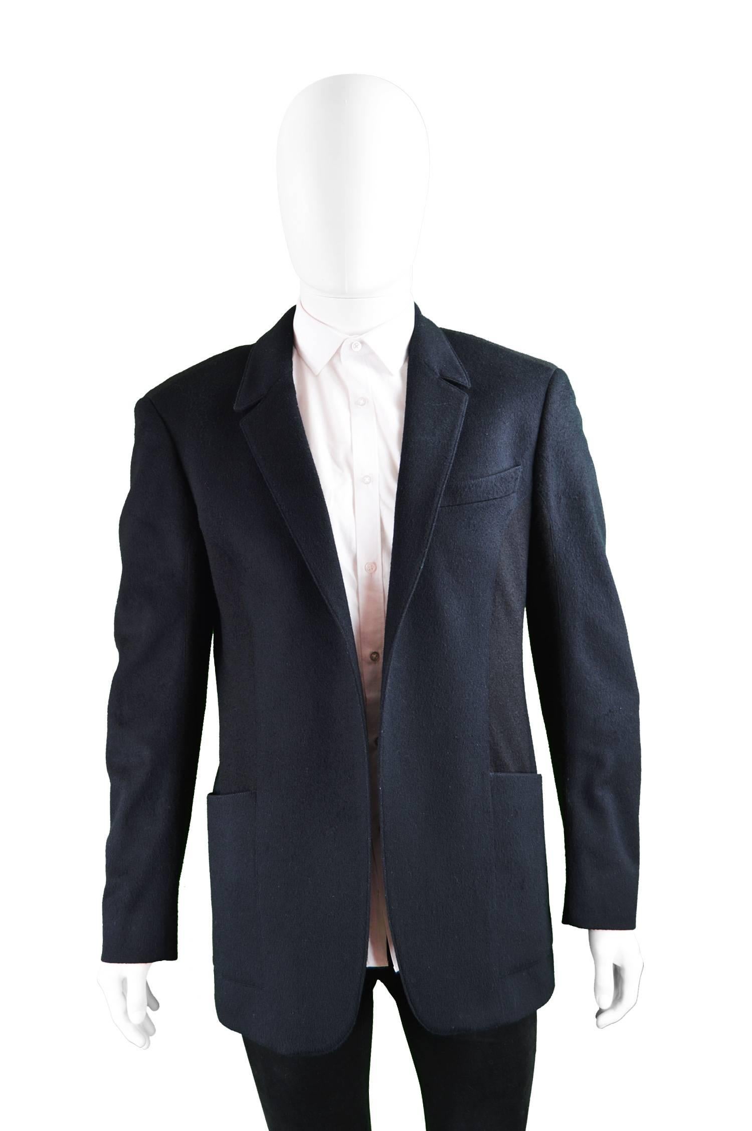 An excellent vintage mens blazer jacket by legendary French fashion designer, Thierry Mugler. Made in Italy, it is impeccably tailored with minimalist detailing, the lapels have Mugler's signature pointed collar, offering an edgy, futuristic touch.