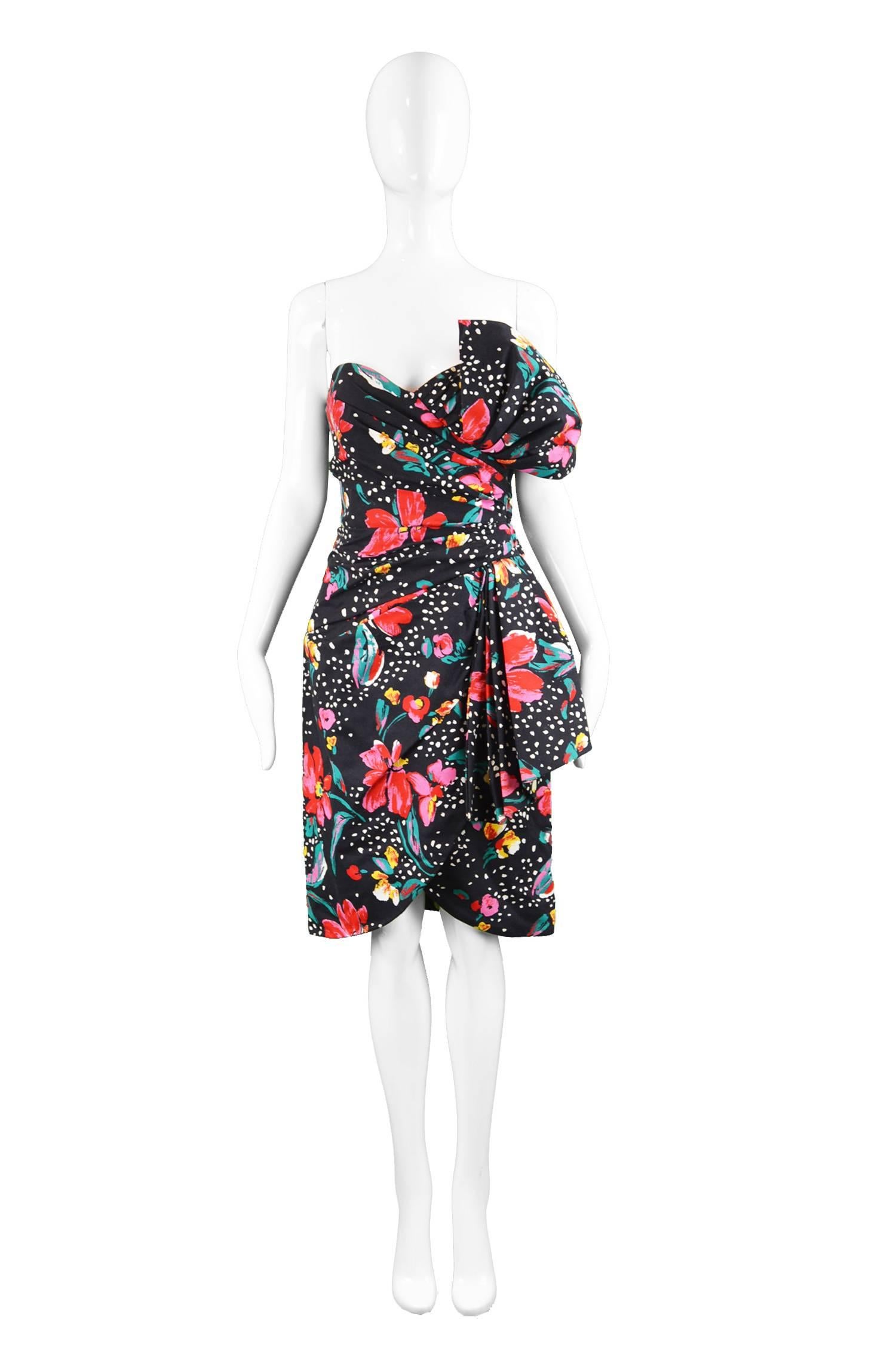 A chic vintage party dress from the 80s by Victor Costa for luxury British department store, Harvey Nichols. In a quality floral printed cotton the soft draping adds a real sensuality working with the boned bodice to create a feminine hourglass