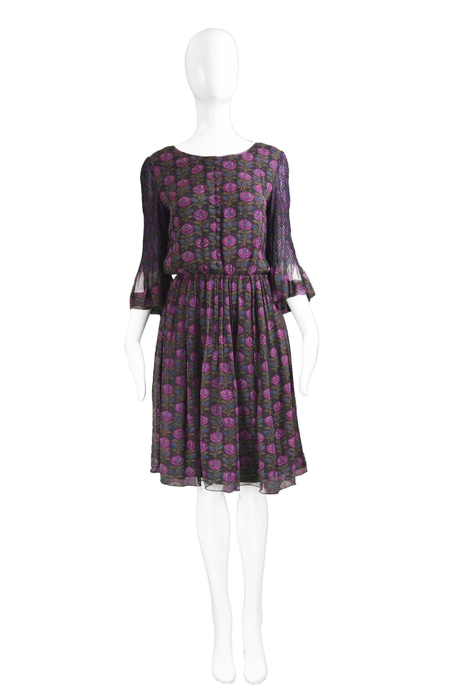 Treacy Lowe Indian Silk Chiffon Black & Purple Floral Embroidered Dress, 1970s

Estimated Size: UK 8/ US 4/ EU 36. Please check measurements. 
Bust - up to 35” / 89cm due to loose bust.
Waist - 26” / 66cm
Hips - up to 42” / 106cm
Length