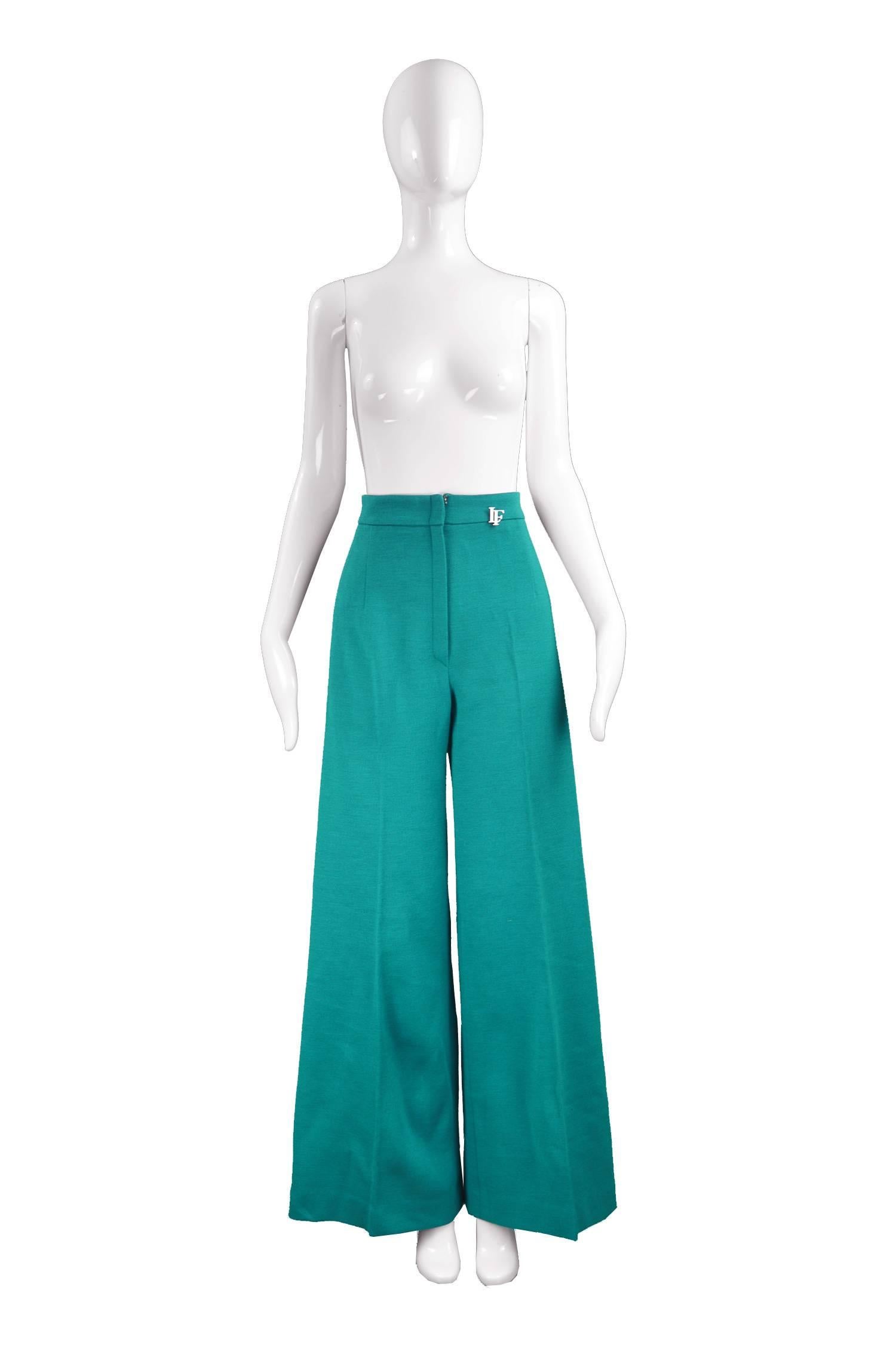 Louis Feraud Vintage Wide Leg Knit Teal Palazzo Pants, 1970s

Estimated Size: UK 8/ US 4/ EU 36. Please check measurements. 
Waist - 26” / 66cm
Hips - 38” / 96cm
Rise - 14” / 35cm
Inside Leg - 33” / 84cm
 
Condition: Excellent Vintage Condition -