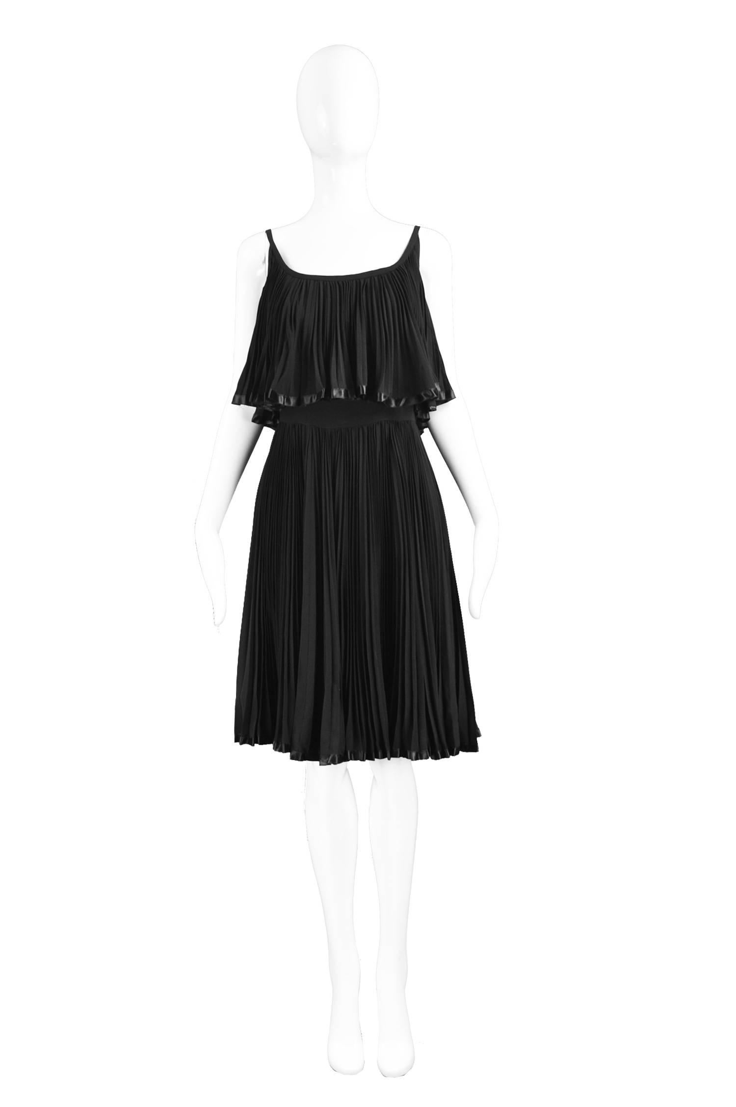 Oleg Cassini Vintage Tiered Pleated Crepe Little Black Dress, 1960s

Estimated Size: UK 8/ US 4/ EU 36. Please check measurements. 
Bust - 34” / 86cm
Waist - 26” / 66cm
Hips - Free
Length (Bust to Hem) - 30” / 76cm
 
Condition: Excellent Vintage
