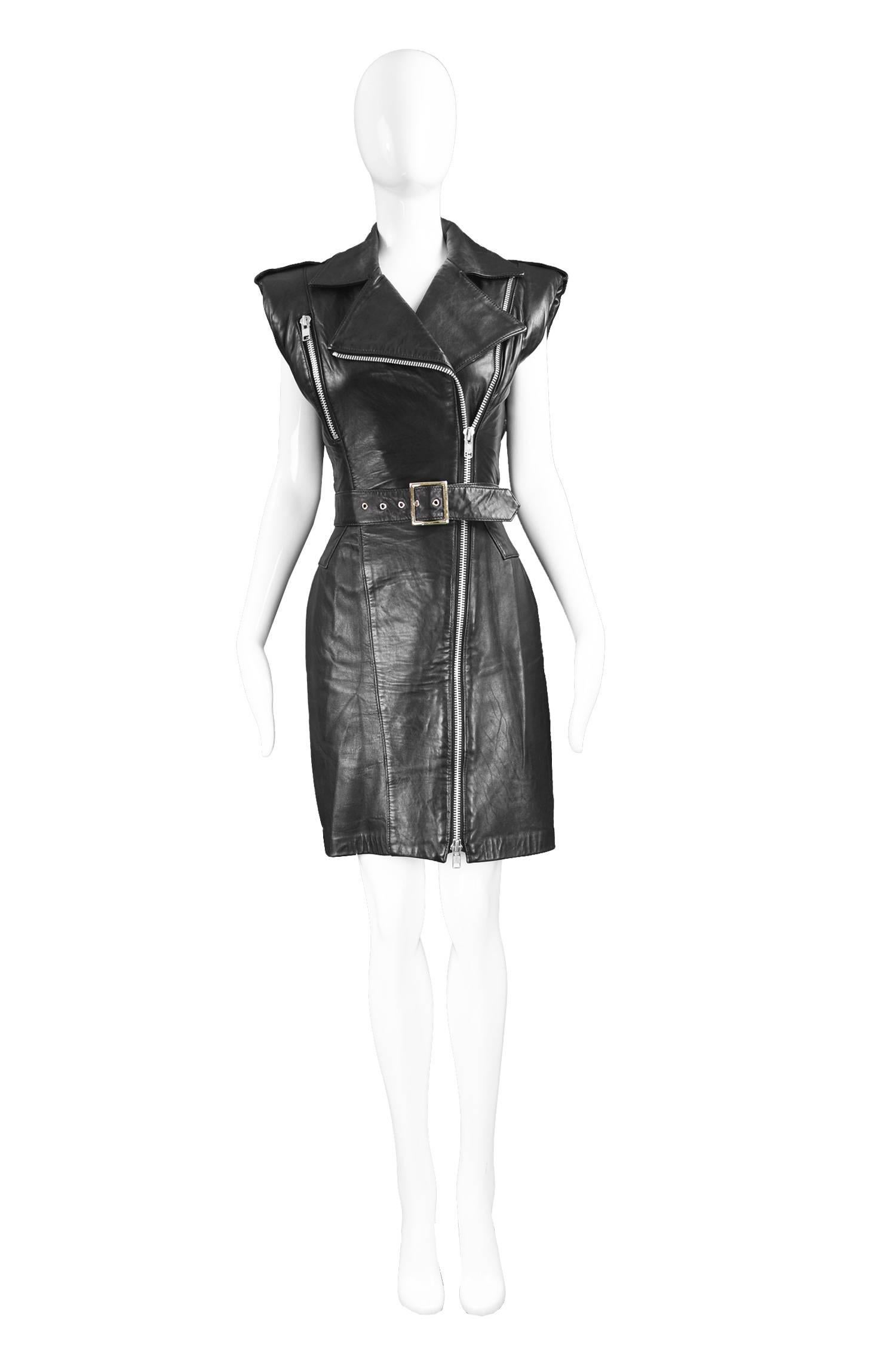Michael Hoban North Beach Leather Black Leather Biker Style Dress, 1980s

Size: Marked Small. Fits roughly like a UK 8/ US 4/ EU 36. Please check measurements.
Bust - 34” / 86cm
Waist - 26” / 66cm
Hips - 36” / 91cm
Length (Shoulder to Hem) - 36” /