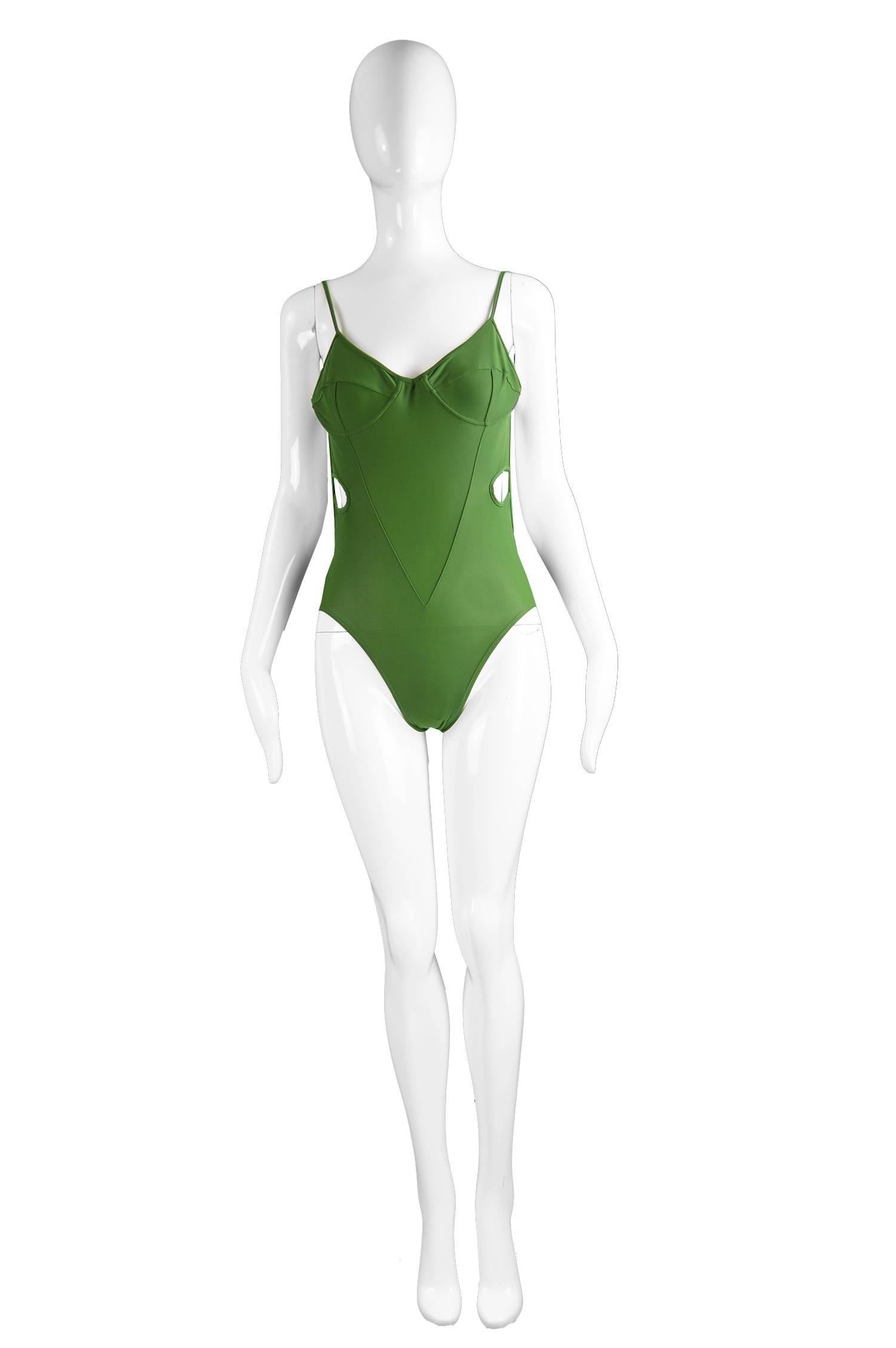 Early John Galliano London Green Cut Out Swimsuit Made in Britain, 1980s

Size: Marked US 8 / UK 10 / EU 36 / Hips 35” / 89cm

Condition: Excellent Vintage Condition - No noticeable stains, tears or holes.

A rare vintage bathing suit by John
