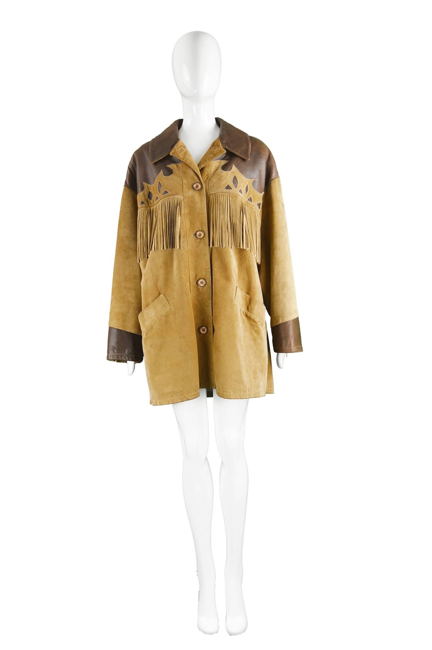 Byblos Italian Leather & Suede Oversized Western Style Fringed Jacket, 1980s

Size: best fits a women's Medium to Large / men's Medium but these sizes gives an intentional oversized fit.
Bust - up to 50” / 127cm
Length (Shoulder to Hem) - 30” /