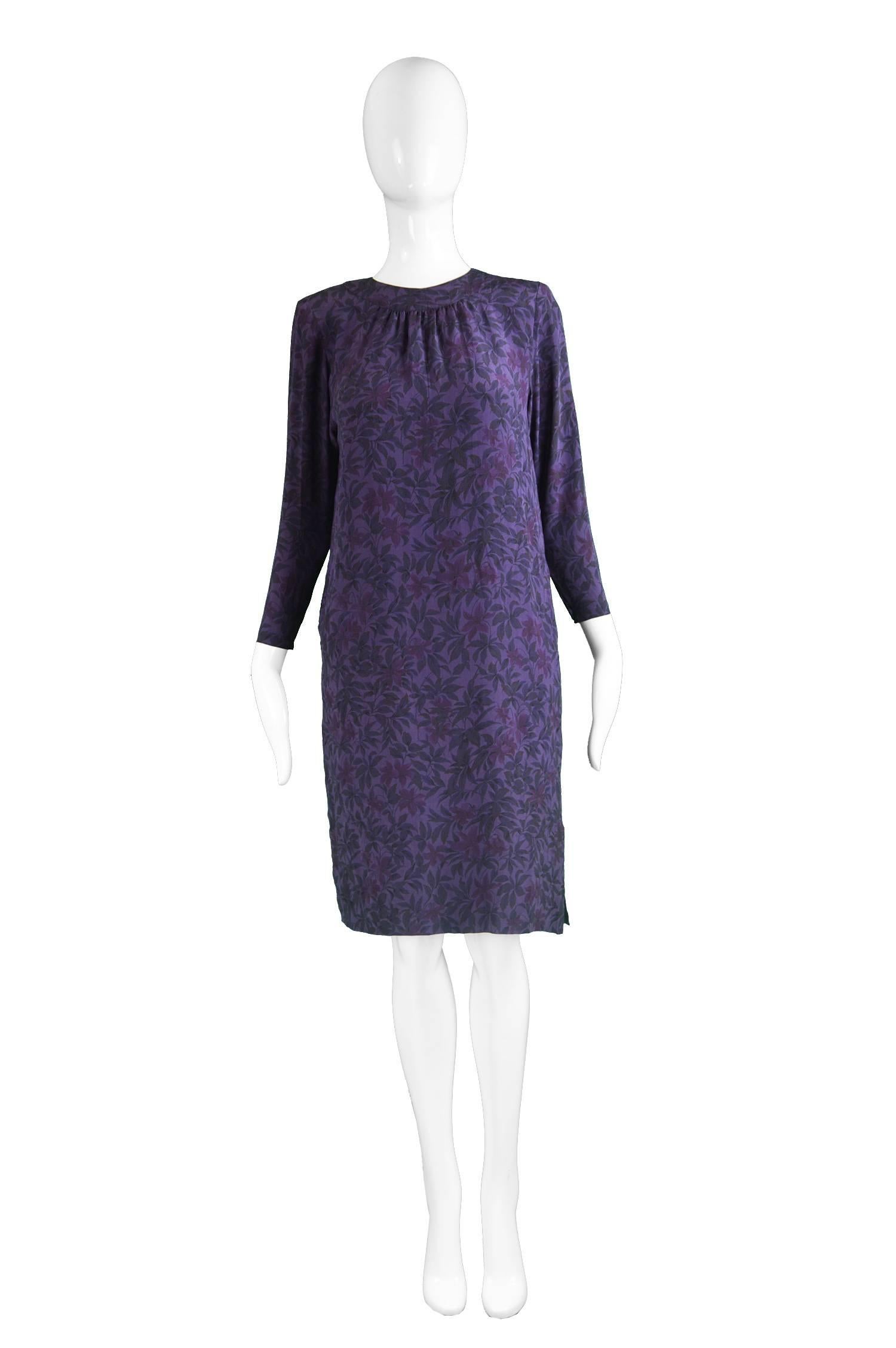 Hanae Mori Purple Vintage Hibiscus Print Simple Silk Shift Dress, 1980s

Estimated Size: UK 12-14/  US 8-10/ EU 40-42.
Bust - 38” / 96cm
Waist - up to 38” / 96cm
Hips - 38” / 96cm
Length (Shoulder to Hem) - 37” / 94cm
Shoulder to Shoulder - 14” /
