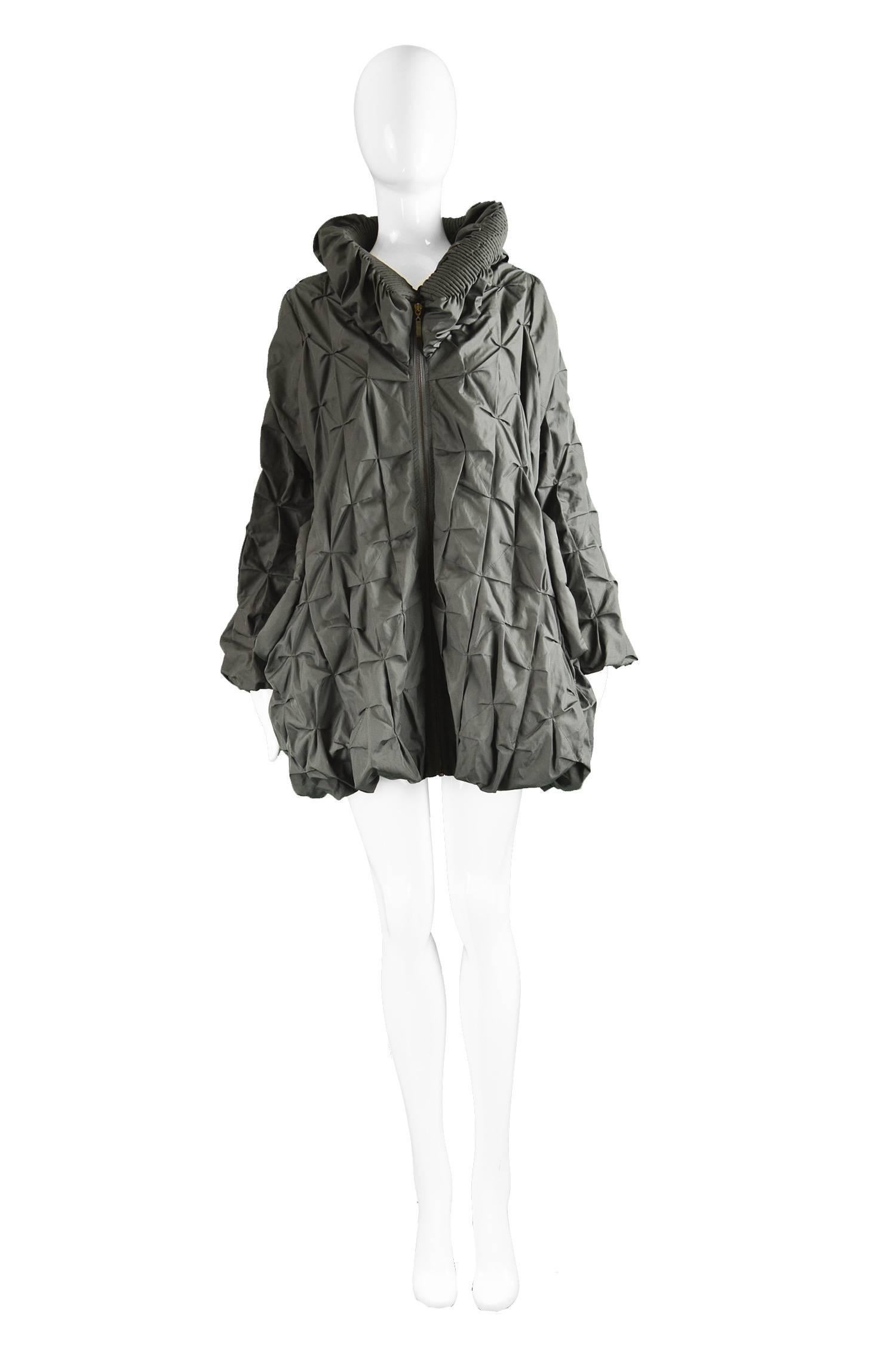 Lanvin Avant Garde Grey Geometric Pleated Oversized Jacket, Spring 2008

Size: Marked a women's Large but it has a loose, swing fit so will suit smaller. Please check measurements. 
Bust - up to 46” / 117cm
Length (Shoulder to Hem) - 30” /