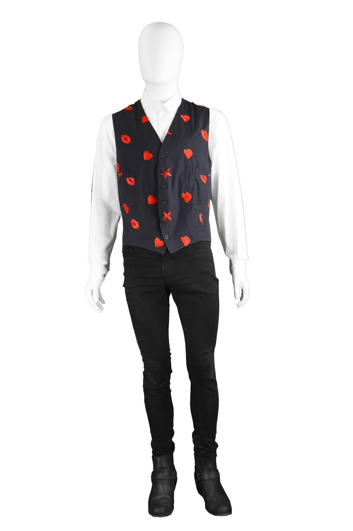 Paul Smith Men's Vintage Black & Red Embroidered Waistcoat, 1990s

Size: Marked XL but fits more like a modern Large. Please check measurements to ensure fit. 
Chest -42” / 106cm
Waist - 36” / 91cm (adjustable
Length (Shoulder to Hem) - 22” /