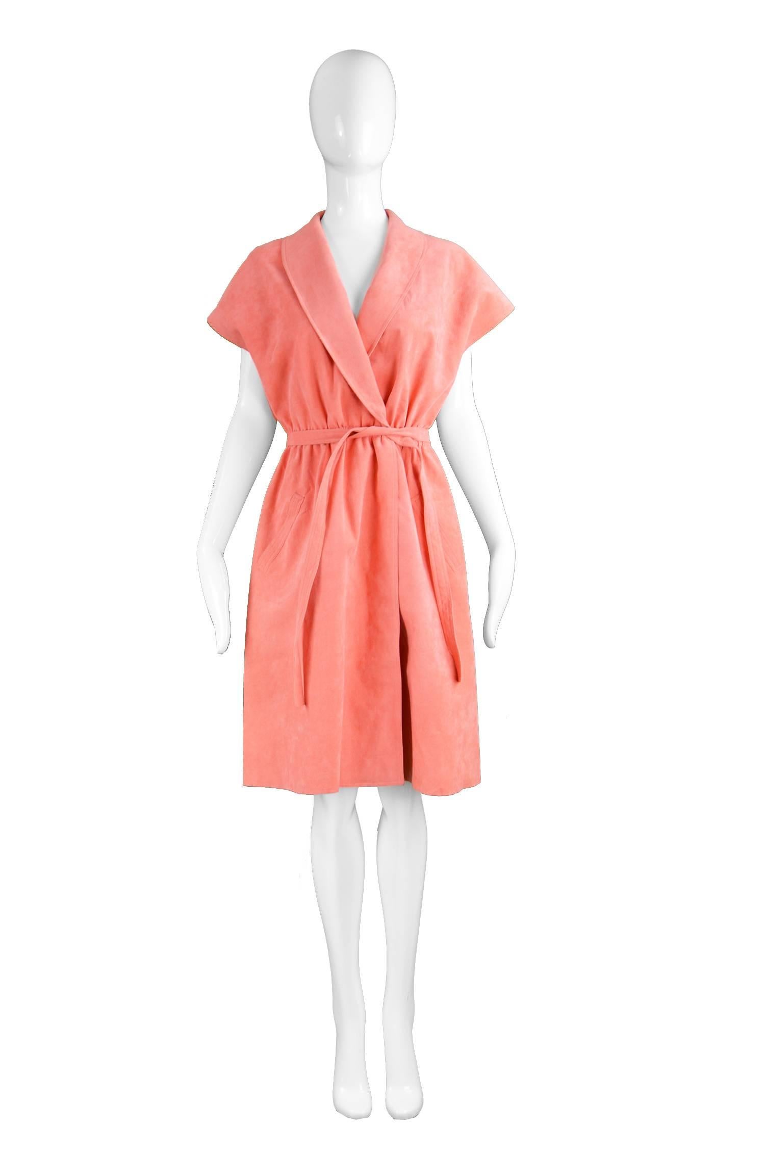 Halston Vintage Ultrasuede Coral Peach Cap Sleeve Dress, 1970s 

Estimated Size: UK 14/ US 10/ EU 42. Please check measurements to ensure fit. 
Bust - 38” / 96cm
Waist - Stretches from 28-34” / 71-86cm
Hips - 44” / 112cm
Length (Shoulder to Hem) -