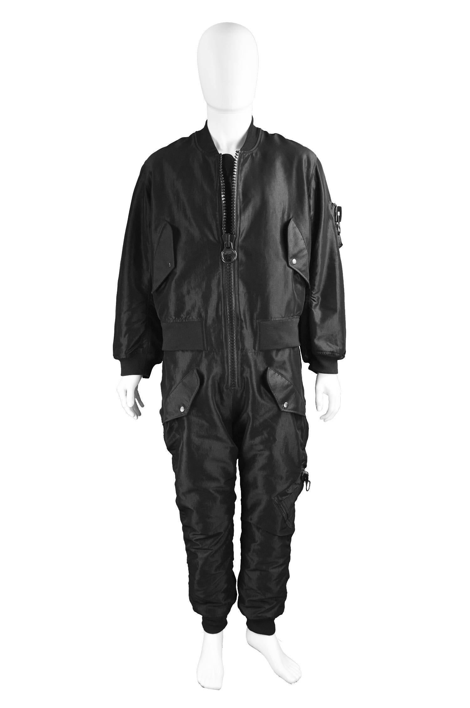 KTZ Rare Mens Black Quilted All in One Boiler Suit / Jumpsuit L

Size: Marked Men's L but could fit XL due to loose fit
Chest - up to 48” / 122cm up to (has a loose fit on top like a bomber jacket)
Waist - up to 40” / 101cm
Inside Leg - 29” /