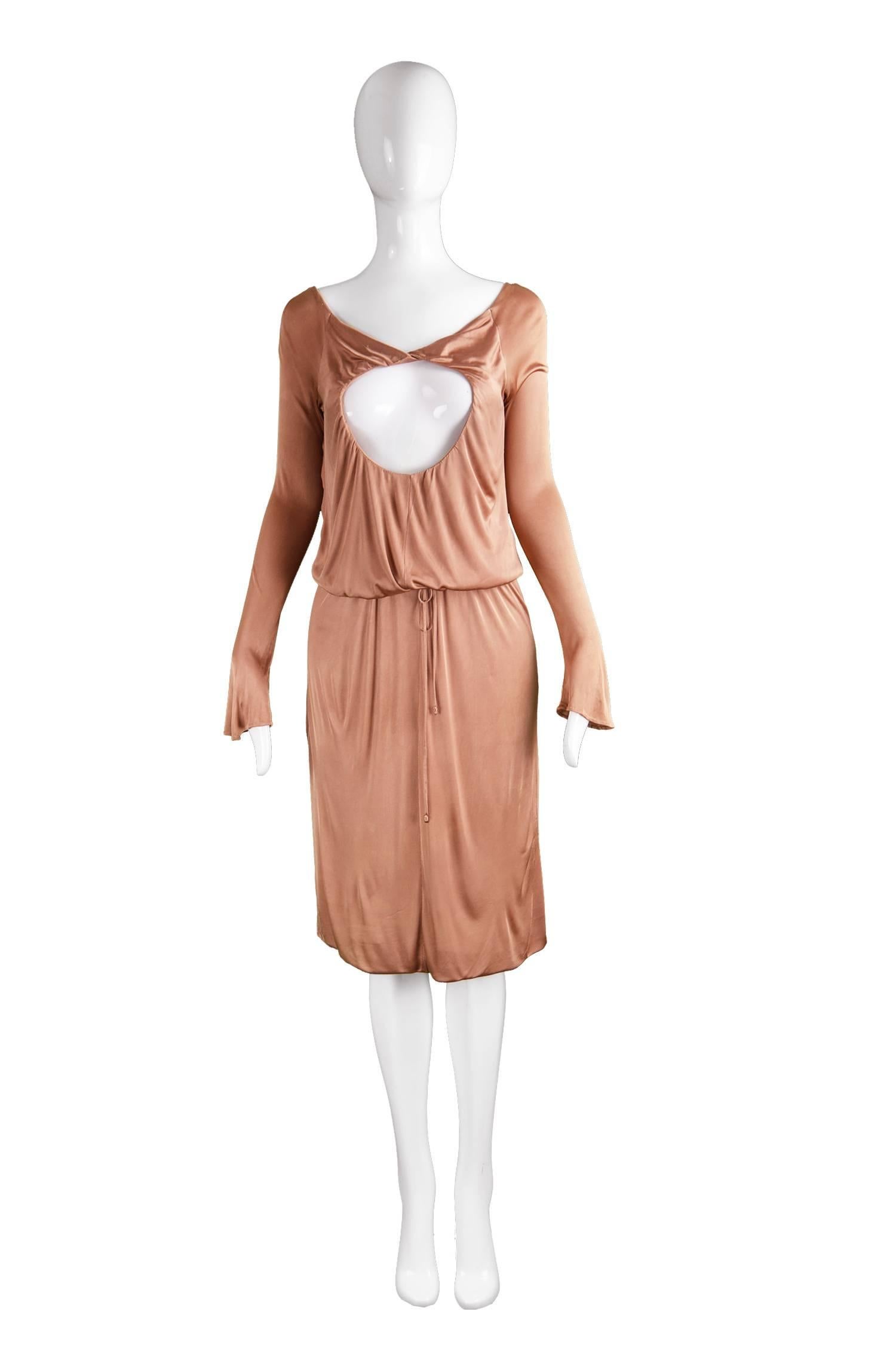 Alexander McQueen Nude Jersey 'Pantheon as Lecum' Jersey Dress, A/W 2004

Size: Marked 38 which is roughly a UK 10/ US 6. Please check measurements.
Bust - 34” / 86cm
Waist - Up to 32” / 81cm (Can be pulled in with drawstring)
Hips - 40” /