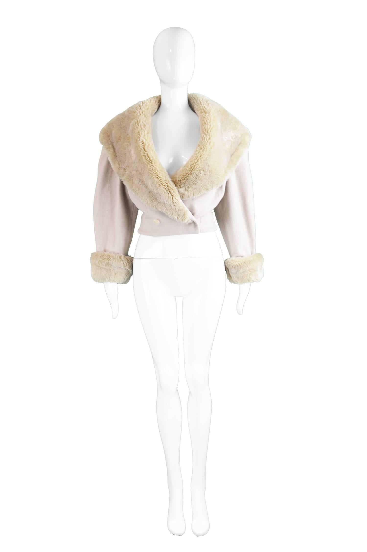 Byblos Crop Nude Wool Jacket with Dramatic Faux Fur Collar, 1980s

Estimated Size: UK 10 / US 6/ EU 38. Please check measurements.  
Bust - 38” / 96cm (has a loose fit on the bust)
Waist - 28” / 71cm
Length (Shoulder to Hem) - 17” / 43cm
Sleeve Pit
