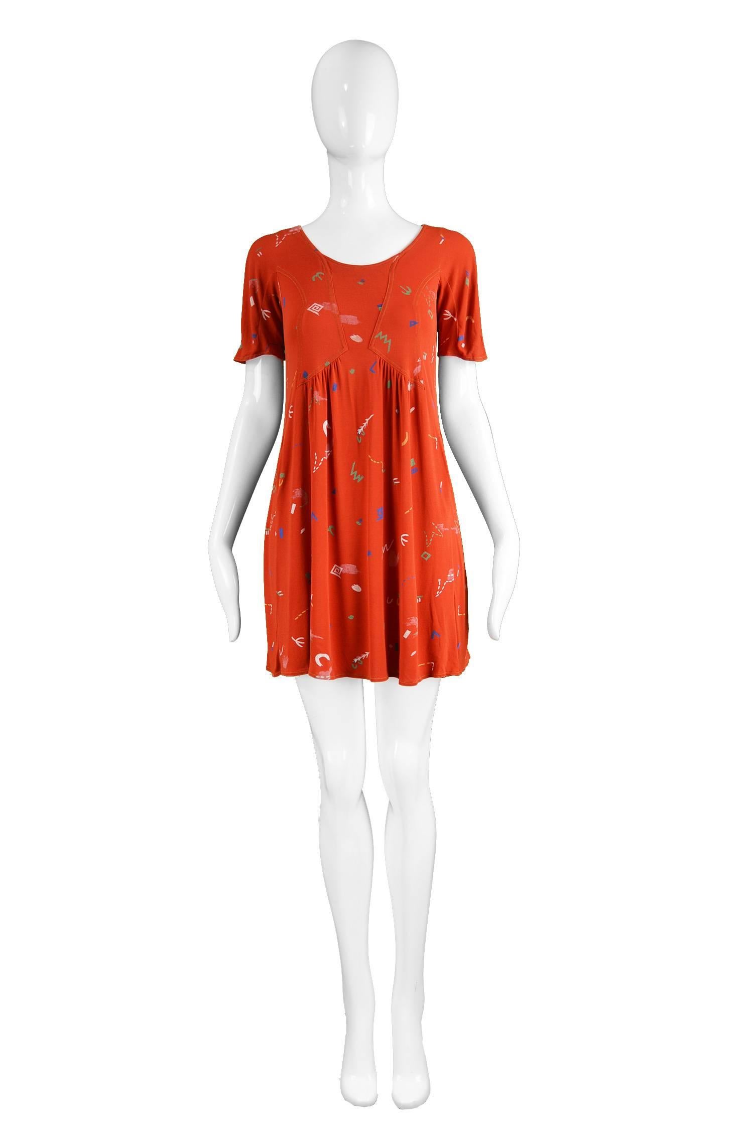Jean Muir 1976 Vintage Red Atomic Print Matte Jersey Mini Dress

Estimated Size: UK 10/ US 6/ EU 38. Please check measurements.
Bust - 34” / 86cm
Waist - 34” / 86cm 
Hips - 42” / 106cm
Length (Shoulder to Hem) - 30” / 76cm

Condition: Excellent