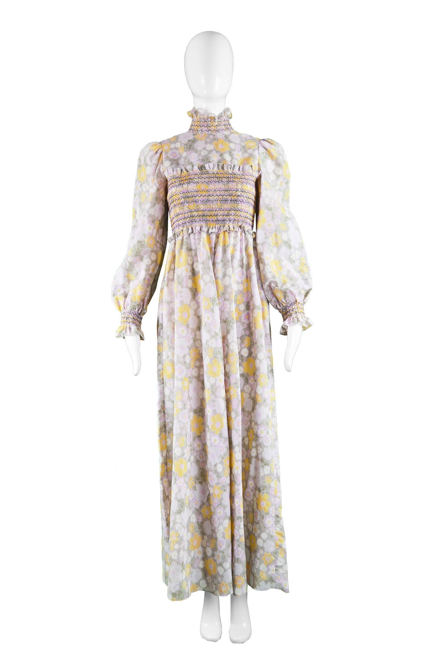 Roland Klein for Marcel Fenez Smocked Floral Voile Maxi Dress, 1970s

Estimated Size: UK 6/ US 2/ EU 34. Please check measurements. 
Bust - 32” / 81cm
Waist - 24” / 61cm
Hips - Free
Length (Shoulder to Hem) - 55” / 140cm
Sleeve Pit to Cuff - 19” /