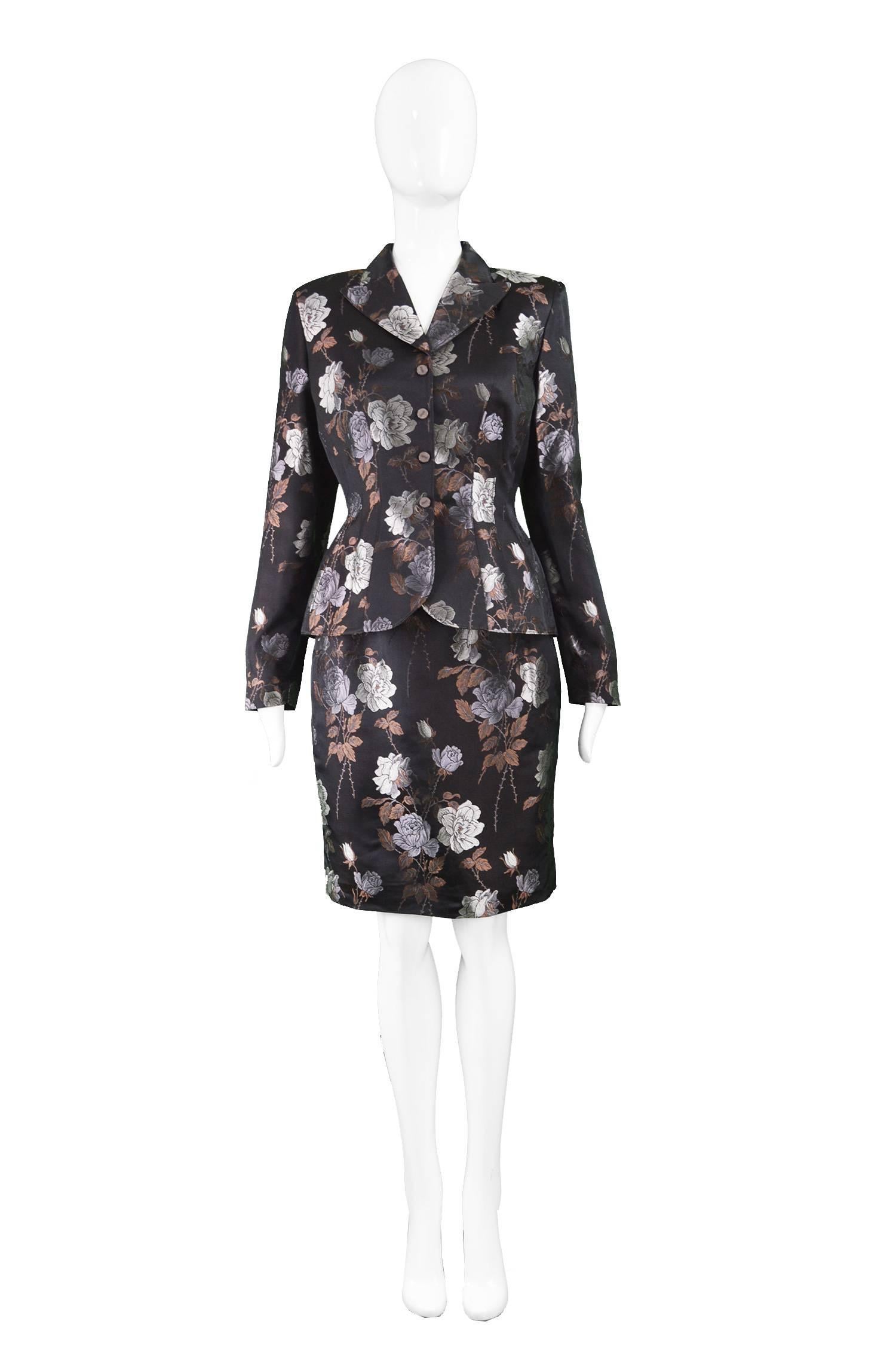 Thierry Mugler Black Satin Jacquard Vintage Two Piece Skirt Suit, 1990s

Estimated Size: UK 10-12/ US 6-8/ EU 38-40. Please check measurements.
Jacket
Bust - 38” / 96cm (allow a couple of inches room for movement)
Waist - 28” / 71cm
Length (Shoulder