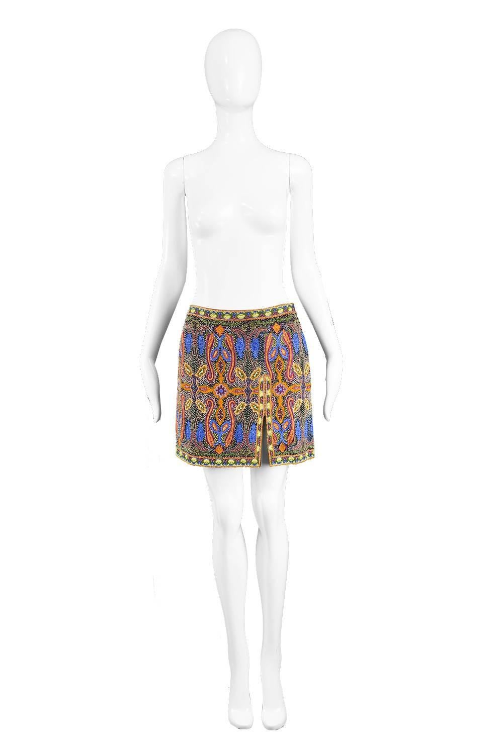 Escada Vintage Intricately Embroidered and Beaded Mini Skirt, 1990s

Size: EU 38 / UK 10 / US 6. Please check measurements.
Waist - 28” / 71cm
Hips - up to 36” / 91cm
Length (Waist to Hem) - 16” / 30cm

Condition: Excellent Vintage Condition - No