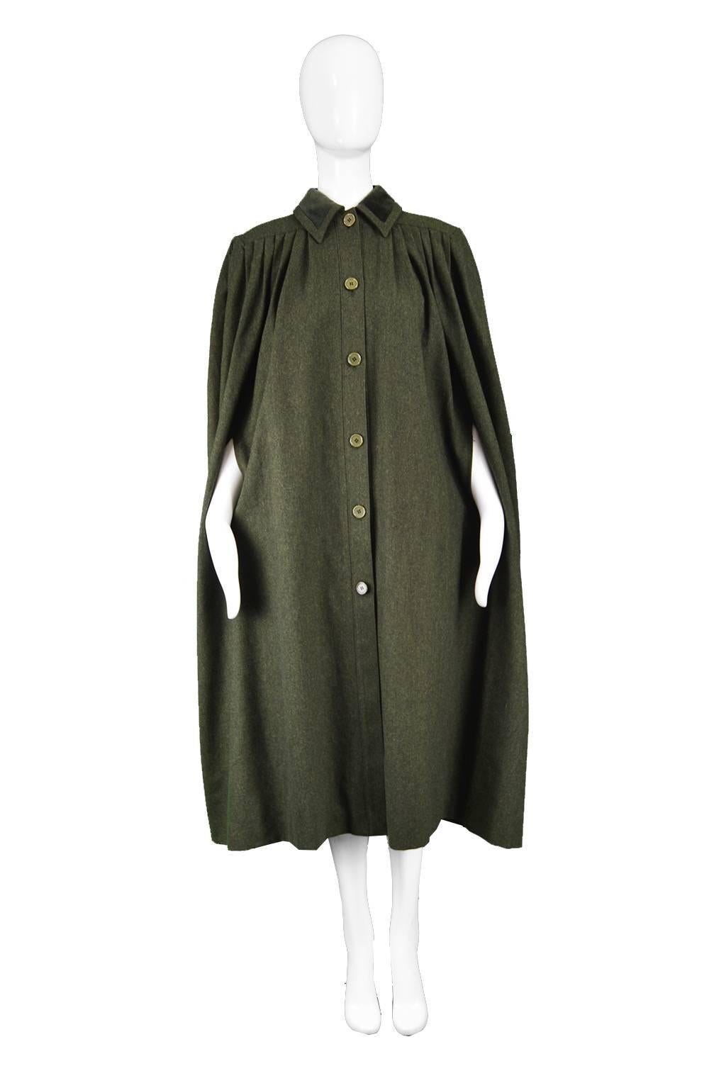 Valentino Dark Green Vintage Wool & Velvet Pleated Maxi Cape Coat, 1980s

Estimated Size: women's Medium to Large, would fit most sizes but due to the amount of fabric it might swamp a more petite lady 
Bust - Free
Waist - Free
Hips -