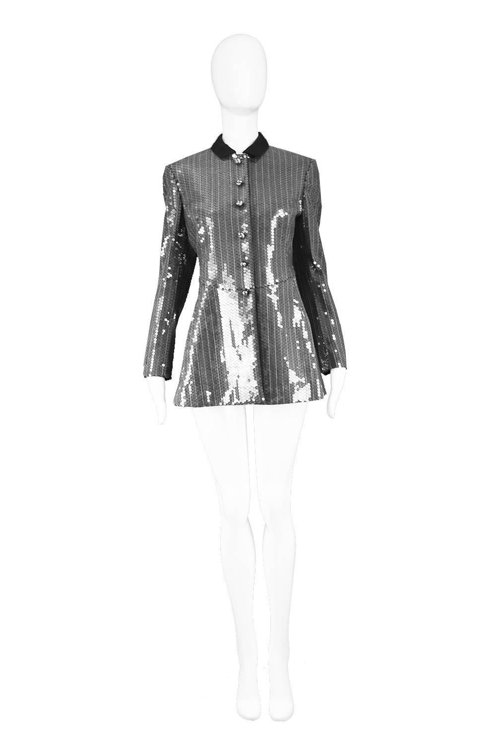 Moschino Couture Clear / Silver Sequinned Striped Tailored Military Jacket

Size: Marked GB 10 / US 8 / I 42 / D 38
Bust - 34” / 96cm
Waist - 30” / 76cm
Hips - 38” / 96cm
Length (Shoulder to Hem) - 27” / 68cm
Shoulder to Shoulder - 16” / 40cm
Sleeve