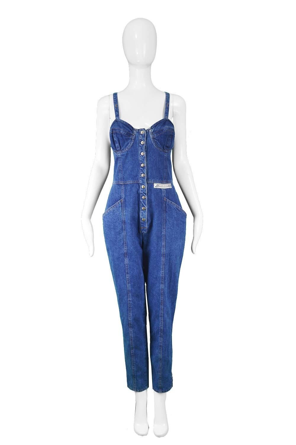 Krizia Jeans Vintage Blue Underwired Denim Dungaree Jumpsuit, 1990s

Estimated Size: UK 10/ US 6/ EU 38. Please check measurements.
Bust - 34” / 86cm
Waist - 28” / 71cm
Hips - 38” / 96cm
Length (Shoulder to Hem) - 56” / 142cm
Inside Leg - 28” /