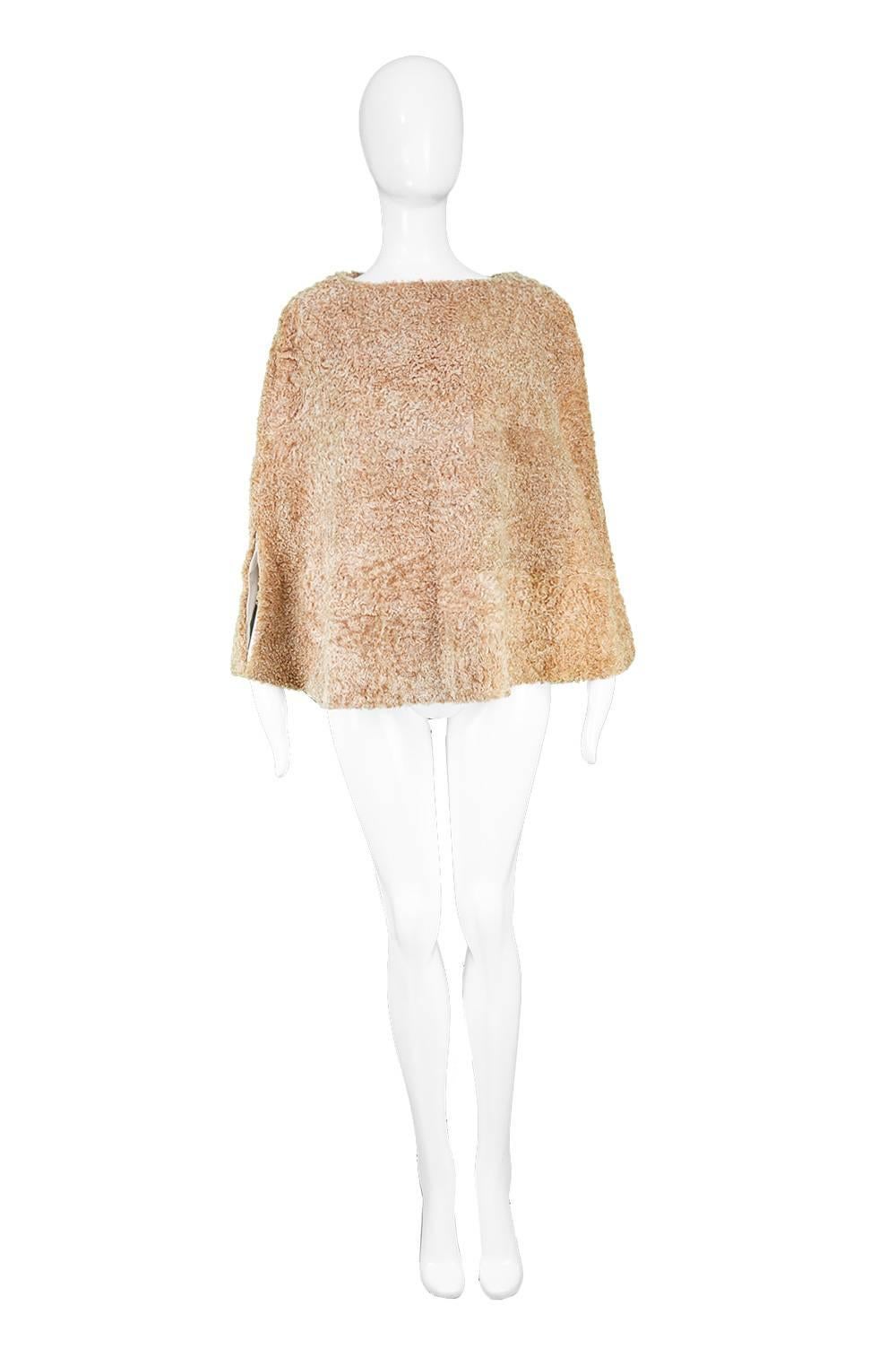 Zandra Rhodes for Pologeorgis Vintage Persian Lamb Fur Poncho Cape, 1990s

Size: One Size fits most meant to have a loose fit like most capes.
Bust - Up to 52” / 132cm 
Waist - Free
Hips - Free
Length (Shoulder to Hem) - 24” / 61cm

Condition: