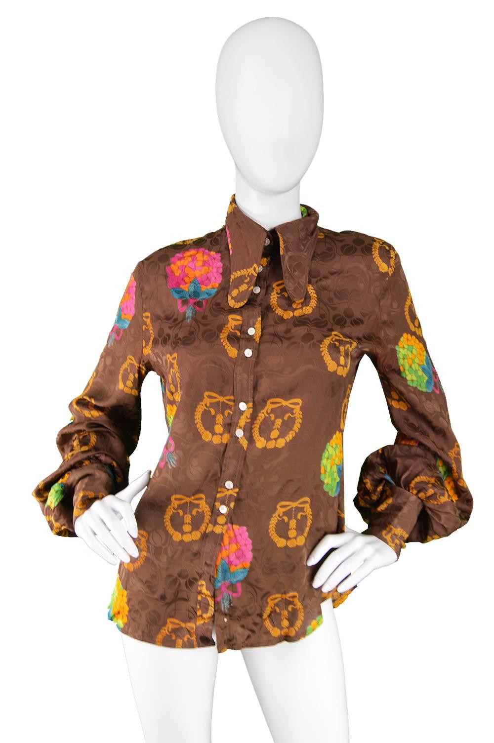 Jeff Banks Vintage Balloon Sleeve Satin Jacquard Beagle Collar Blouse, 1970s

Estimated Size: UK 10-12/ US 6-8/ EU 3840 due to intended loose fit and cuff holes are quite small. 
Bust - 38” / 96cm
Waist - 32” / 81cm
Length (Shoulder to Hem) - 23” /