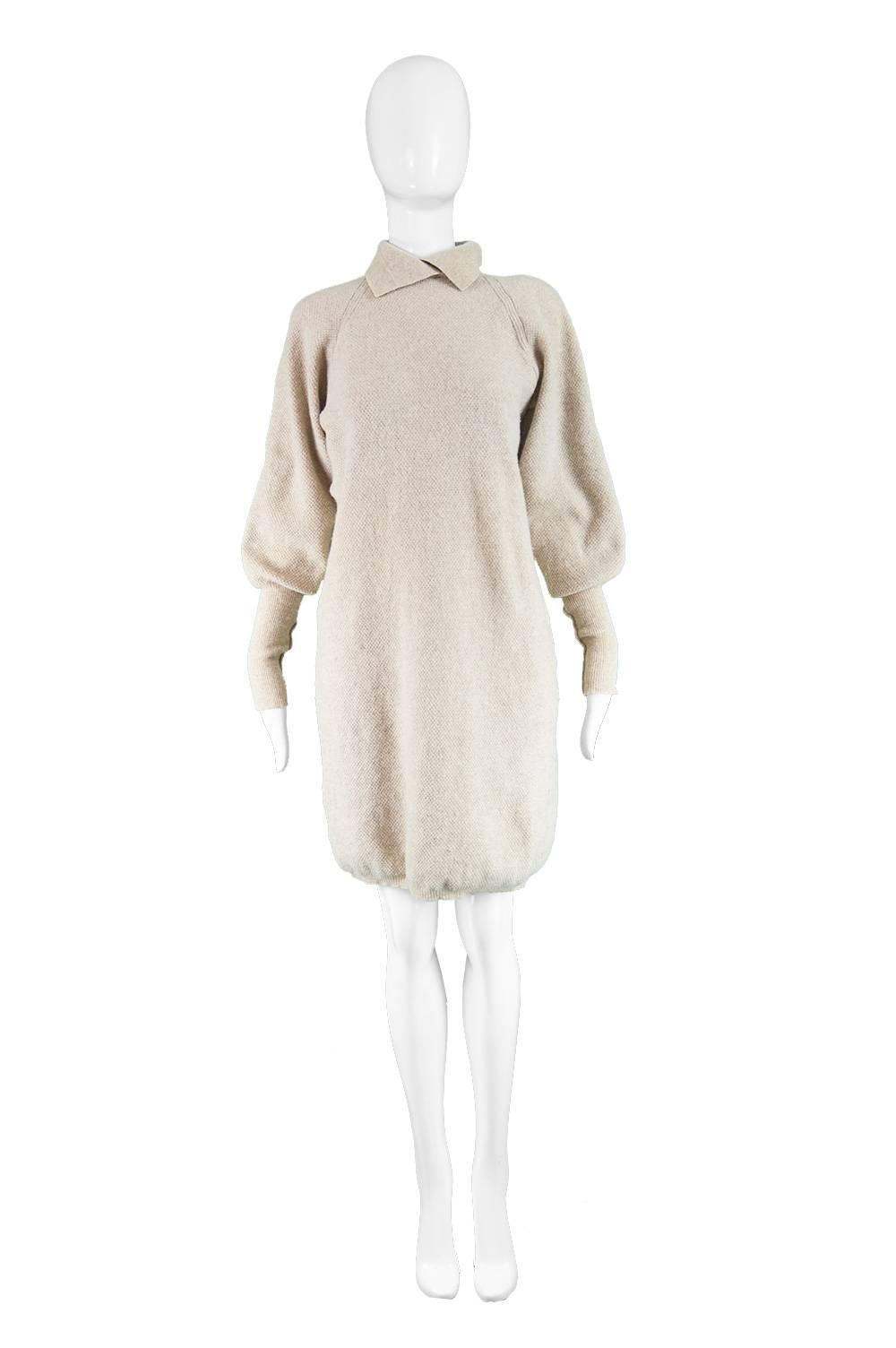Kenzo Vintage Cream Wool Knitted Leg o Mutton Sleeve Sweater Shift Dress, 1980s

A beautiful vintage jumper dress from the 80s by luxury Japanese born, French designer, Kenzo, In a soft, cream / stone colored Italian lambs wool knit fabric with