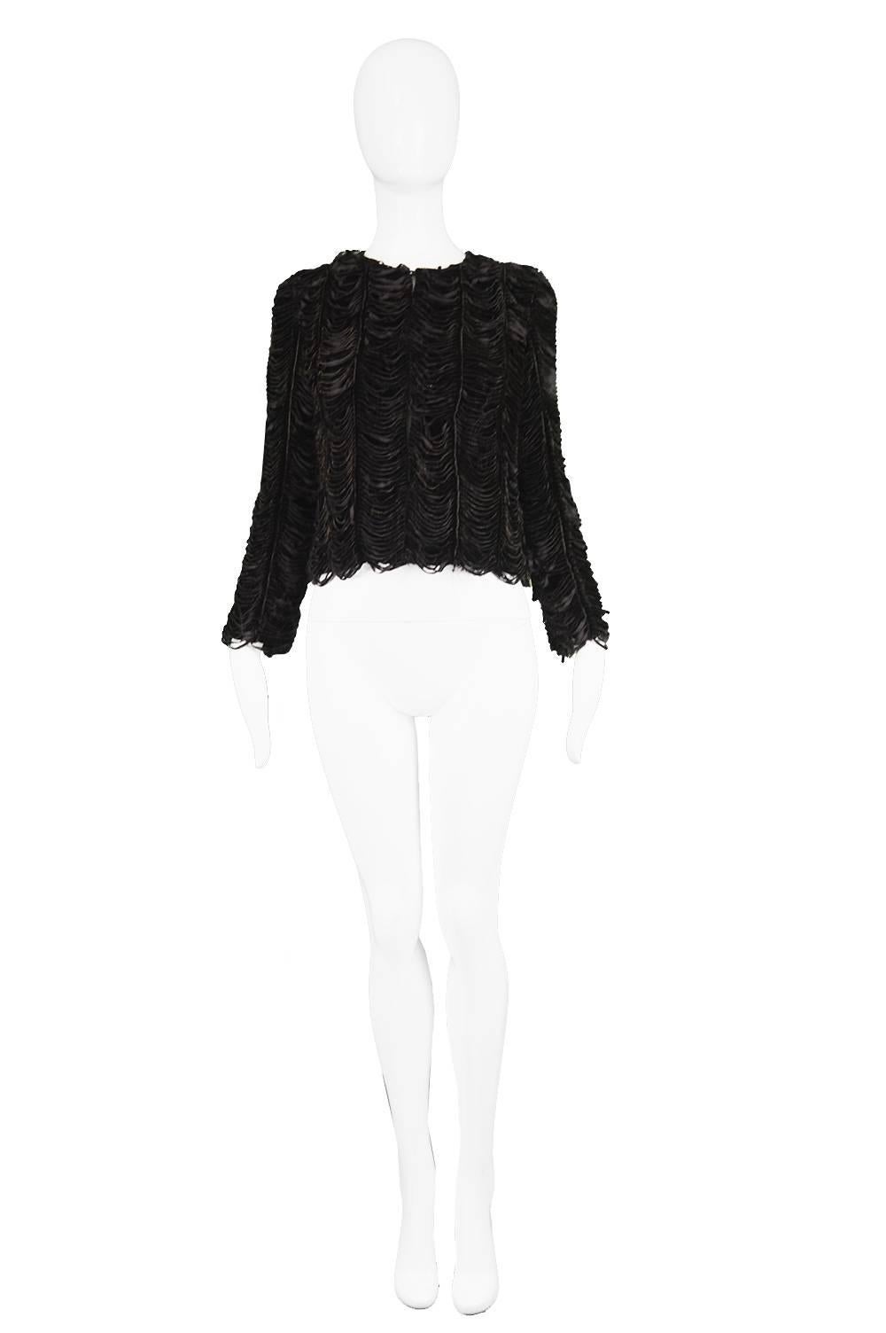 Jean Paul Gaultier Vintage 1990's Shredded Distressed Black Velvet Jacket

Estimated Size: Women's UK 8-10/ US 4-6/ EU 36-38. Please check measurements.
Bust - 34” / 86cm
Waist - 32” / 81cm
Length (Shoulder to Hem) - 18” / 46cm
Shoulder to Shoulder