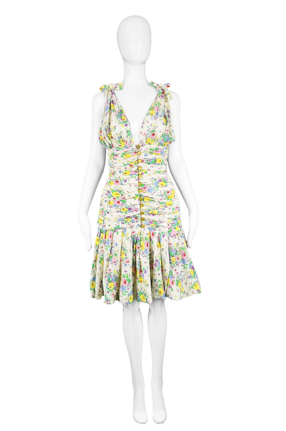 Emanuel Ungaro Vintage Off White Plunging Floral Chiffon Party Dress, 1980s

Estimated Size: UK 8/ US 4/ EU 36. Please check measurements. 
Bust - Free
Underbust - 28” / 71cm
Waist - 26” / 66cm
Hips - 34” / 86cm
Length (Shoulder to Hem) - 38” /