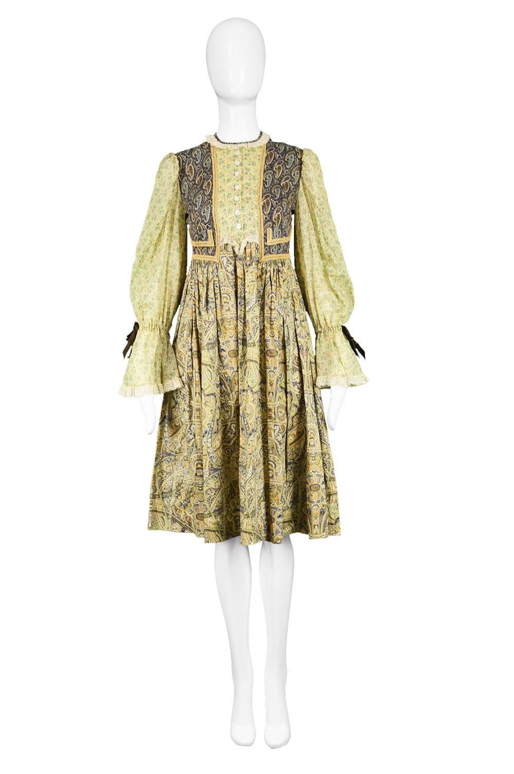 Gina Fratini Vintage Patchwork Fabric Cotton Prairie Dress, 1970s

Estimated Size: UK 10/ US 6/ EU 38. Please check measurements. 
Bust - 34” / 86cm
Waist - 30” / 76cm
Hips - Free
Length (Shoulder to Hem) - 40” / 101cm
Shoulder to Shoulder - 14” /