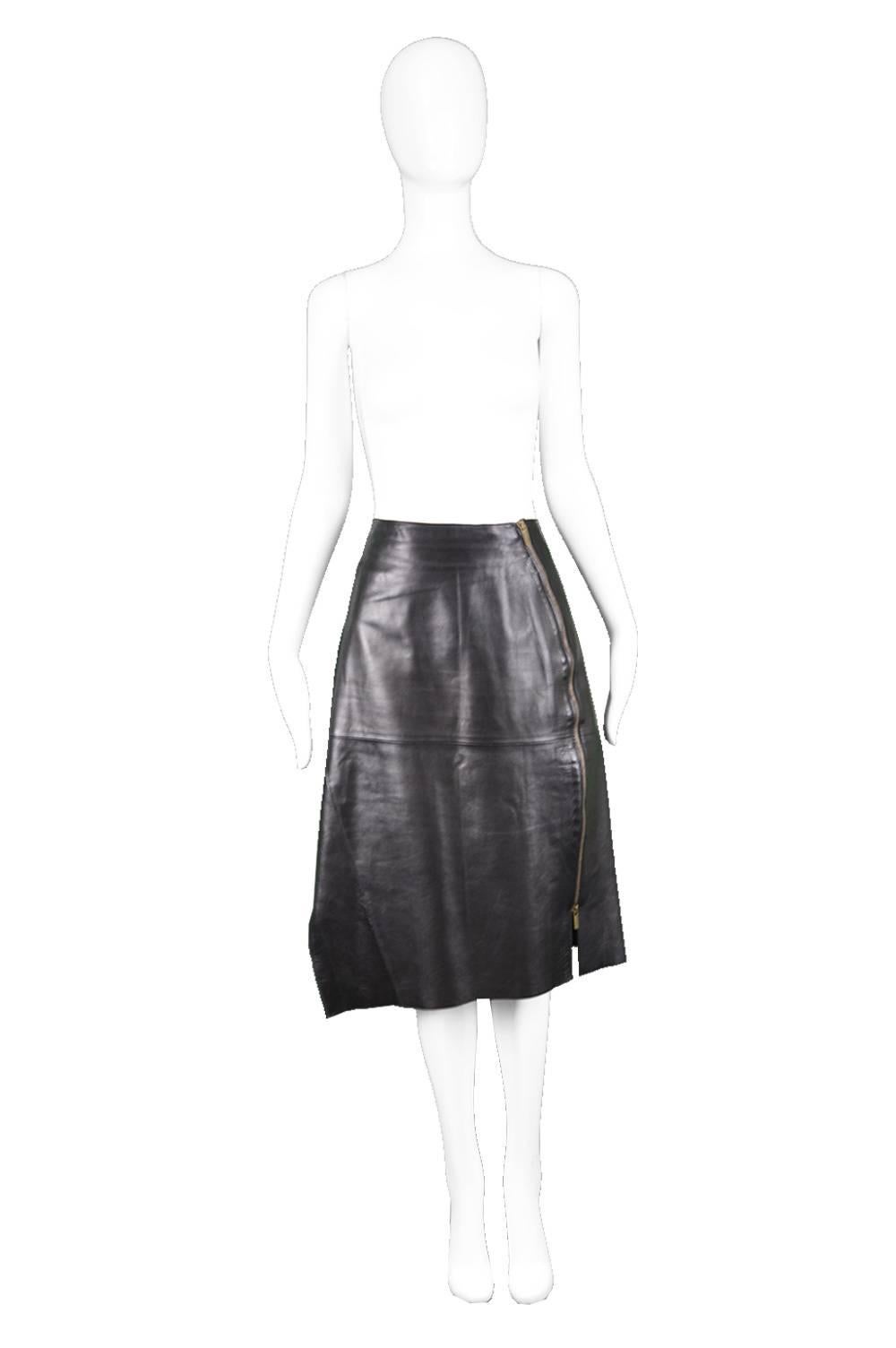 Kenzo Black Lambskin Leather Panelled Asymmetrical Biker Skirt, 1980s

Size: Marked EU 42 which is roughly a UK 14/ US 10. Please check measurements.  
Waist - 32” / 81cm
Hips - 40” / 101cm
Length (Waist to Hem) - 26” / 66cm

Condition: Excellent
