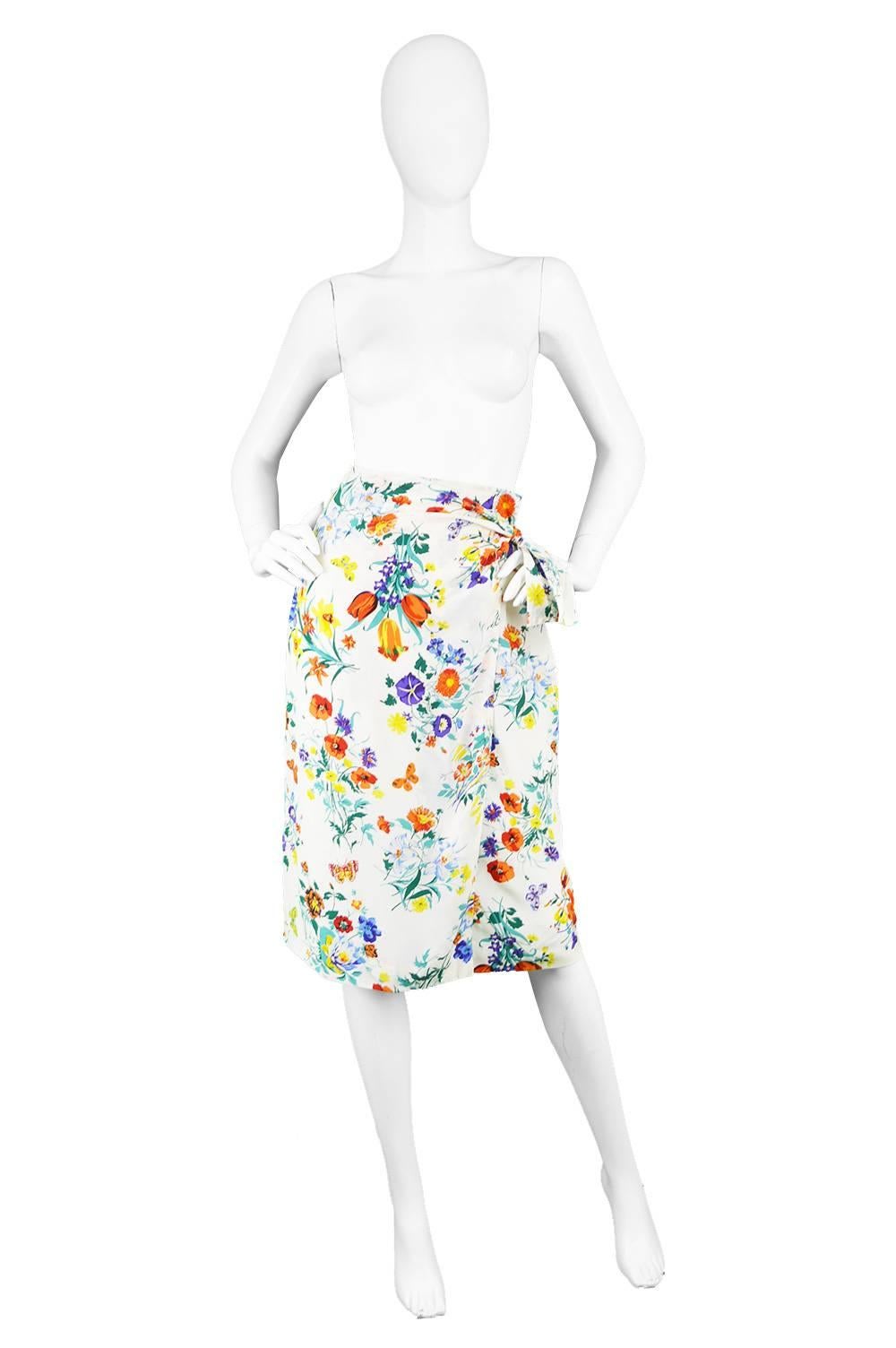 Gucci Vintage 1980s White Silk Floral Print Wrap Skirt

Estimated Size: UK 8/ US 4/ EU 38. Please check measurements.
Waist - 26” / 66cm
Hips - 38” / 96cm
Length (Waist to Hem) - 26” / 66cm

Condition: Excellent Vintage Condition - 1 small faint