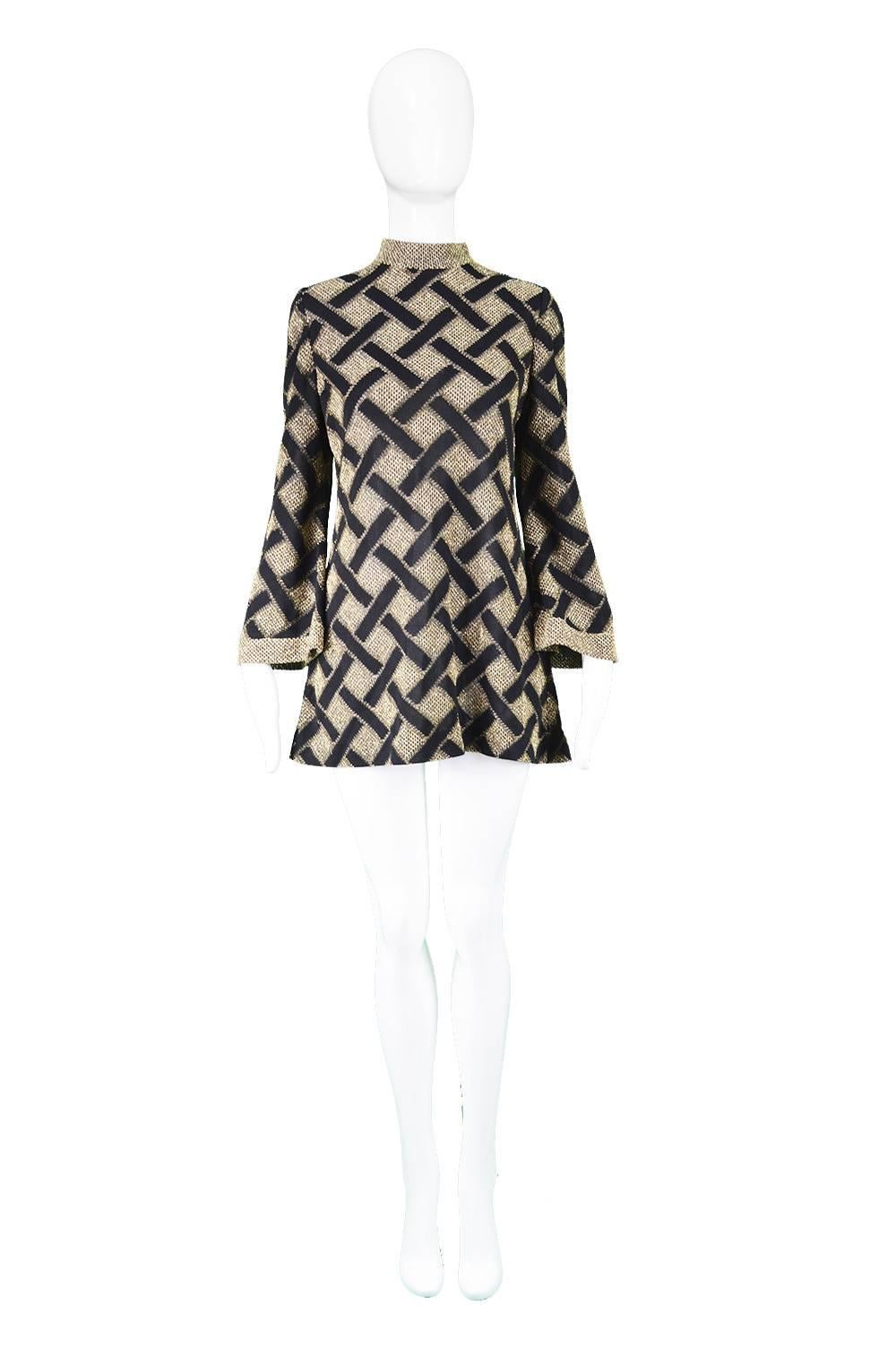 Pierre Balmain 1960s Black & Gold Lamé Vintage Tunic Shirt / Micro Dress

Estimated Size: UK 12/ US 8/ EU 40. Please check measurements. 
Bust - 36” / 91cm
Waist - 32” / 81cm
Hips - 40” / 101cm
Length (Shoulder to Hem) - 28” / 71cm
Shoulder to