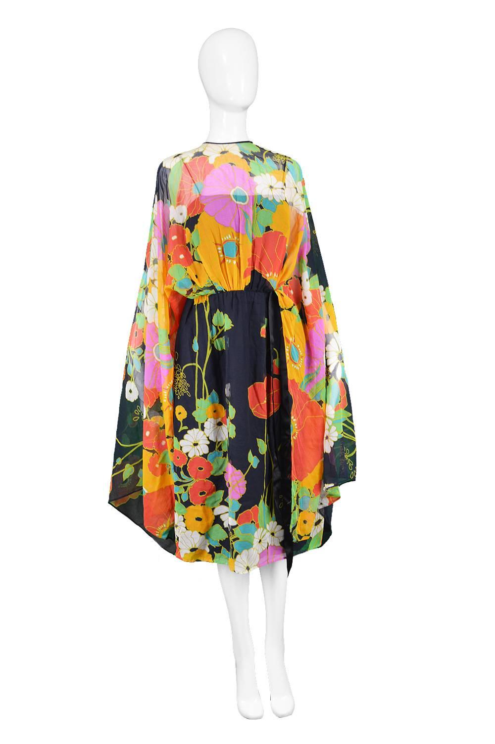 Capriccio Vintage Cotton Kimono Sleeve Vibrant Multicoloured Dress, 1970s

Estimated Size: UK 8/ US 4/ EU 36. Please check measurements. 
Bust - 32” / 81cm
Waist - 28”  / 71cm
Hips - 42” / 106cm
Length (Shoulder to Hem) - 35” / 89cm

Condition: