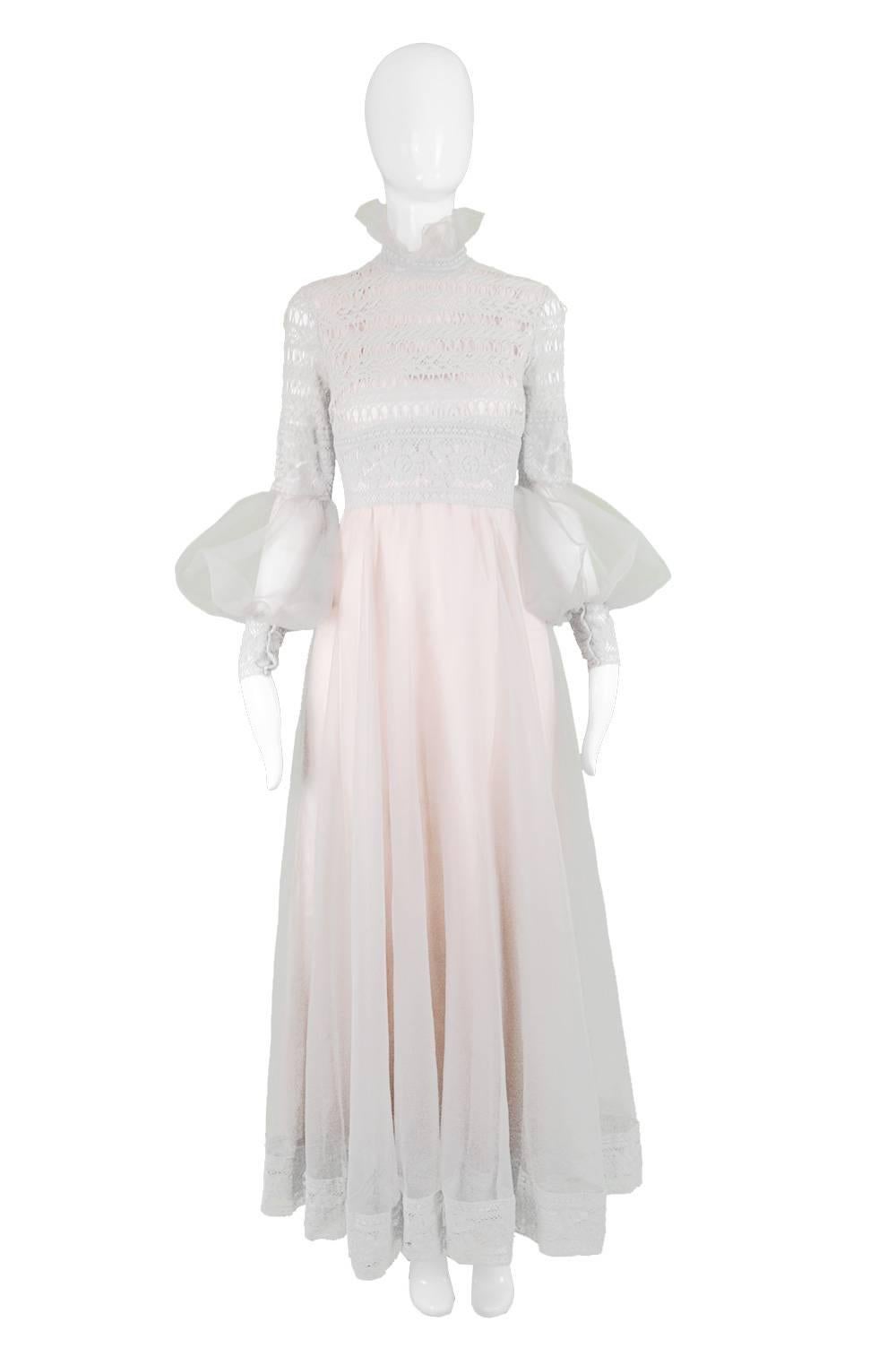 Jean Varon Vintage Gray & Pastel Pink Lace and Organza Evening Gown, 1970s

Estimated Size: UK 10 / US 6/ EU 38. Please check measurements.
Bust - 34” / 86cm
Waist - 28” / 71cm
Hips - 44” / 112cm
Length (Shoulder to Hem) - 53” / 135cm
Shoulder to