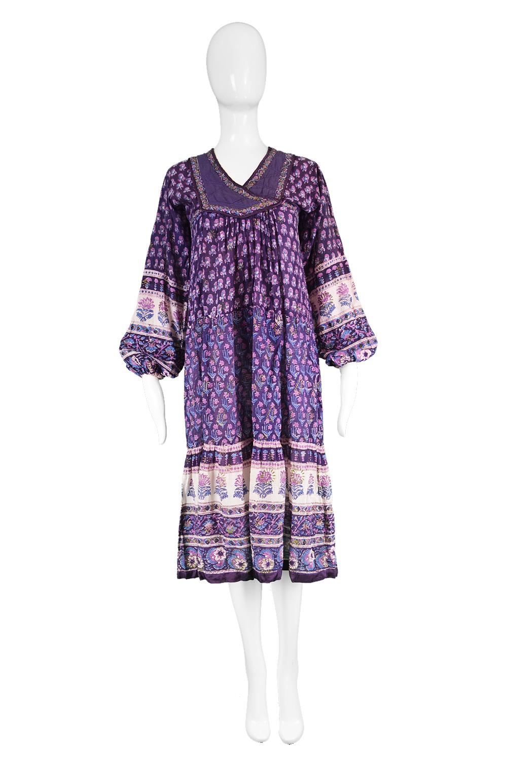 Alpnani Purple Indian Cotton Gauze Block Print Quilted Boho Dress, 1970s

Estimated Size: UK 12/ US 8/ EU 40. Please check measurements.
Bust - 36” / 91cm
Waist - 30” / 76cm
Hips - Free
Length (Shoulder to Hem) - 44” / 112cm
Shoulder to Shoulder -