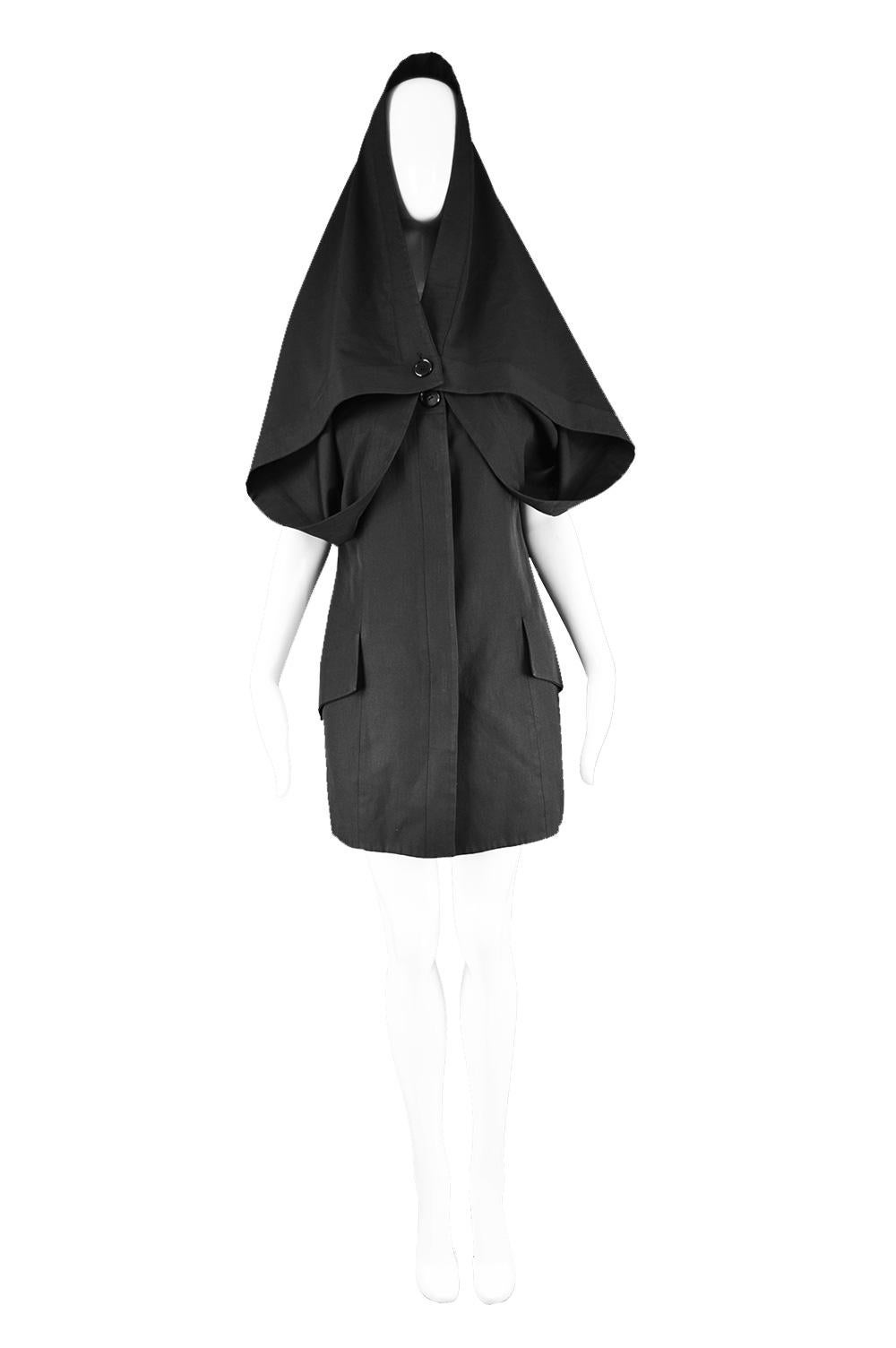 Early John Galliano Black Avant Garde Cape Dress Made in Britain, 1980s

Size: Marked UK 12 which is roughly a US 8/ EU 40. Please check measurements.
Bust - 38” / 96cm (meant to have a loose fit)
Waist - 34” / 86cm
Hips - 40” / 101cm
Length