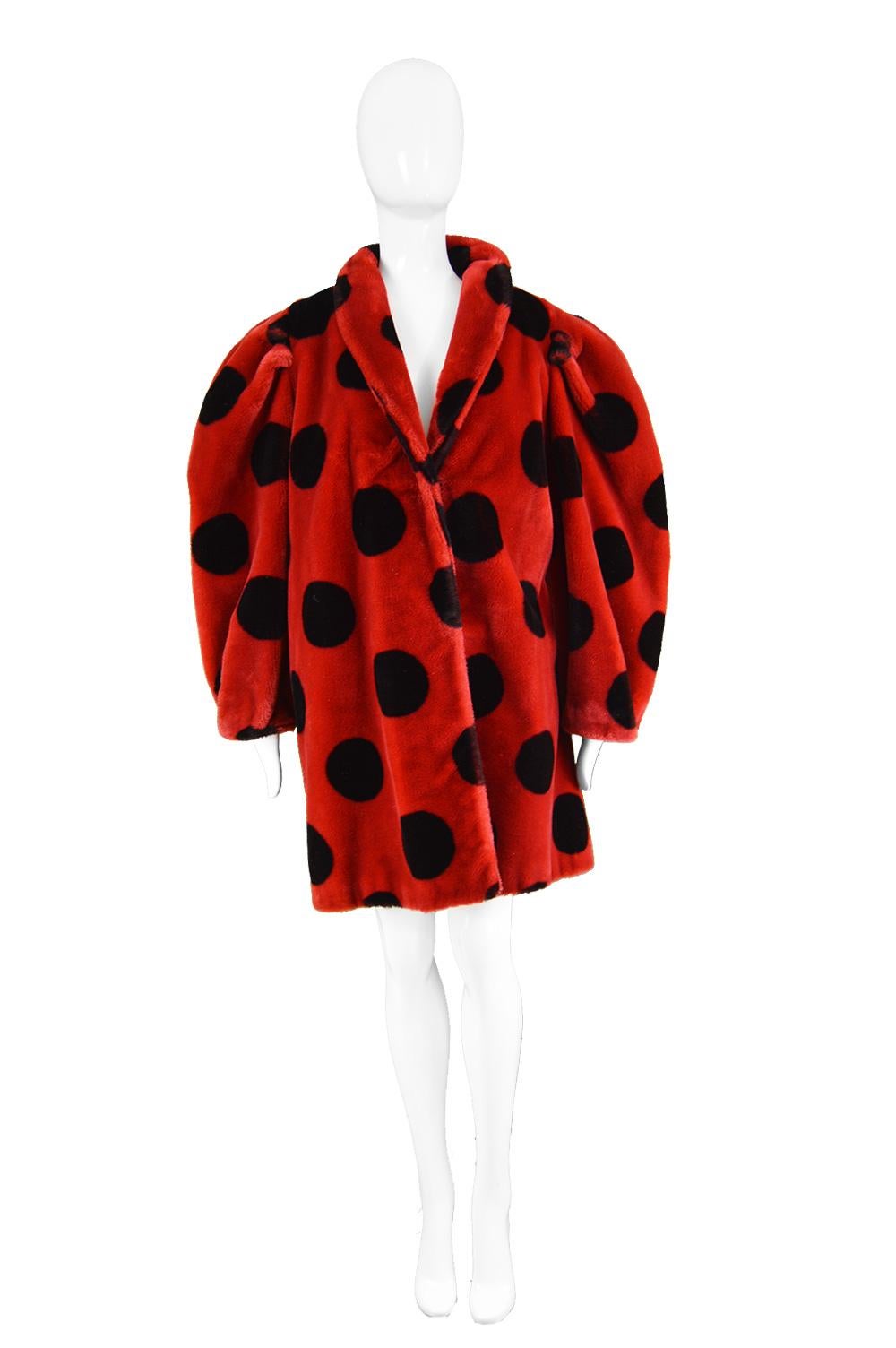 Apparence Paris Striking Red & Black Spotty Vintage Faux Fur Coat, 1980s

Estimated Size: Women's Medium to Large. Meant to have an oversized fit.  
Bust - up to 44” / 112cm 
Waist - 46” / 117cm
Hips - 50” / 127cm
Length (Shoulder to Hem) - 35” /