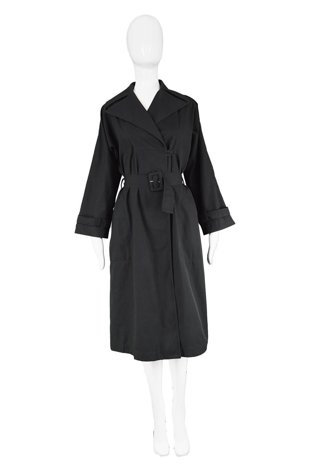 Guy Laroche Vintage Minimalist Women's Black Cotton Trench Coat, 1980s

Estimated Size: UK 10/ US 6/ EU 36, coat is oversized so size is most dependant on the belt. Please check measurements.
Bust - up to 40” / 101cm (meant to have a loose