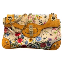Bolso de mano «Flora Bamboo» de Gucci, de lona y seda con strass