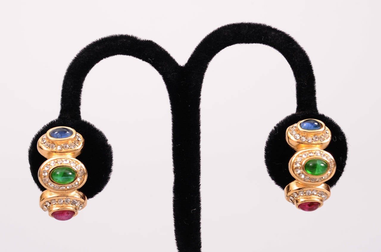 Faux sapphire, emerald and ruby cabochons are surrounded by diamante on these half hoop clip back earrings. They are in excellent condition.
Measurements;
Height 1"
Width 3/8"