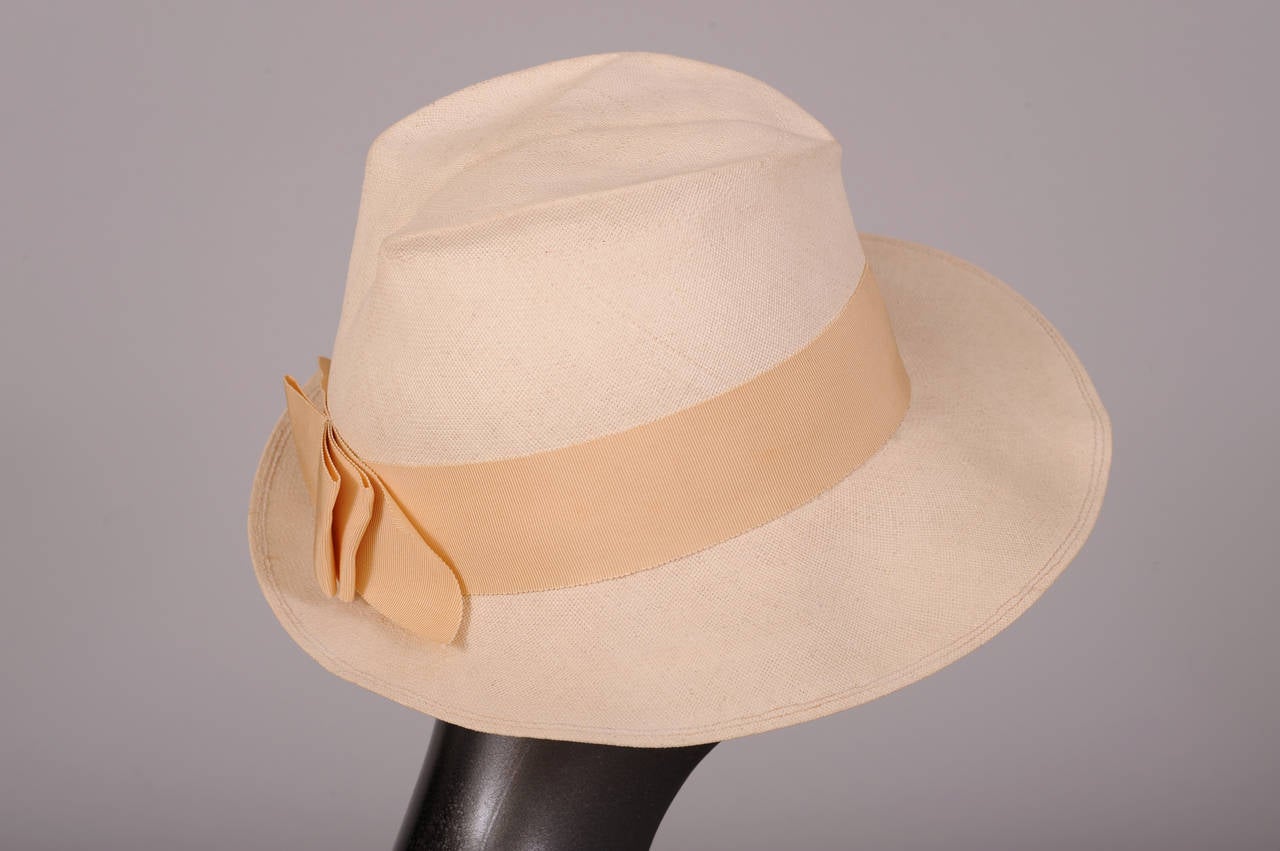 Made from the finest straw, tightly woven by hand, this hat is a rare find. The quality of workmanship is only found in the most expensive Panama hats now, which reach well into the thousands  of dollars. The hat is a feminine version of a classic